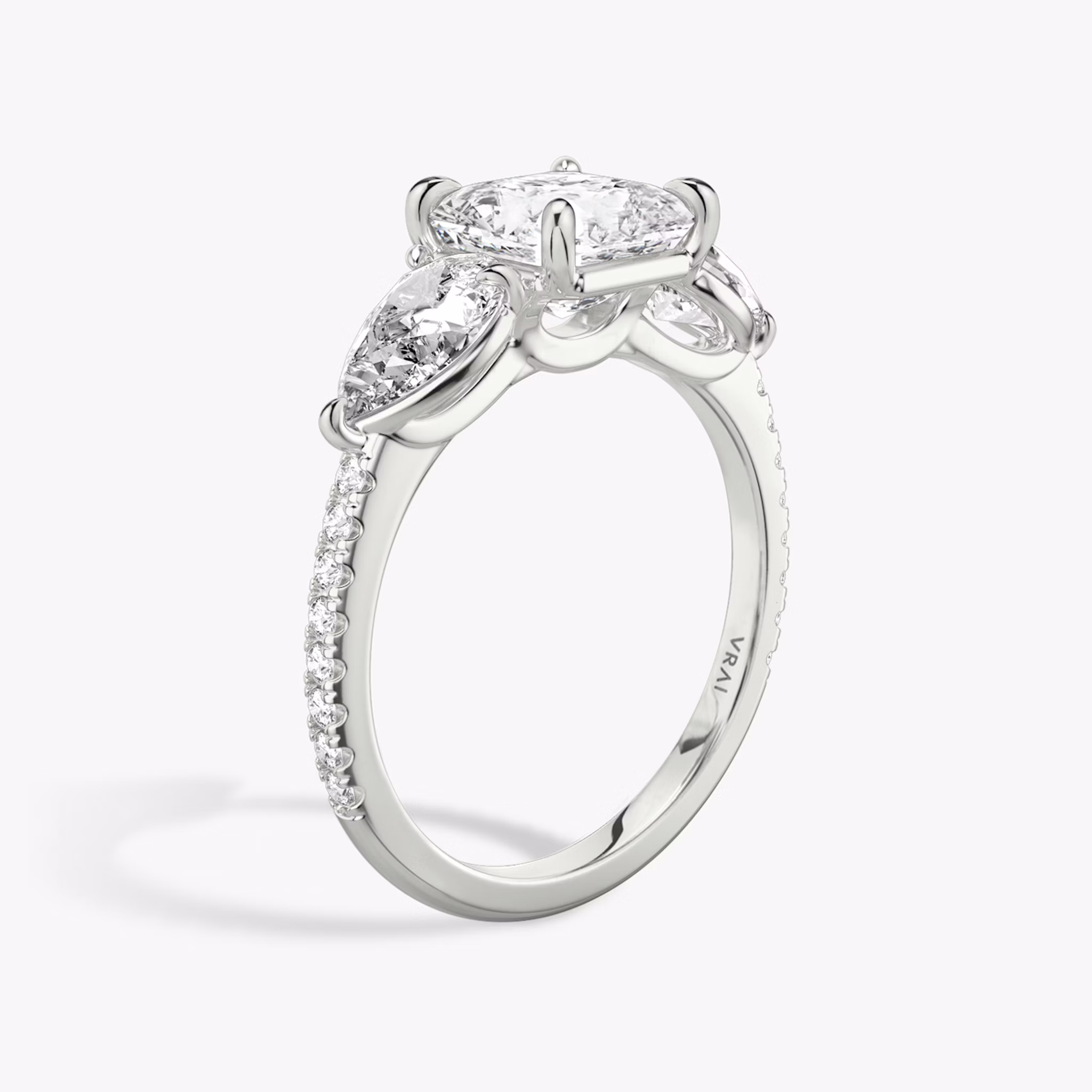 The Three Stone | Asscher | 18k | White Gold | bandAccent: Pavé | sideStoneCarat: 0.50ct | sideStoneShape: Pear | diamondOrientation: vertical | caratWeight: other
