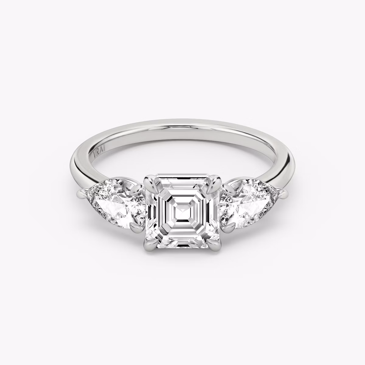 The Three Stone | Asscher | 18k | White Gold | bandAccent: Plain | sideStoneCarat: 0.50ct | sideStoneShape: Pear | diamondOrientation: vertical | caratWeight: other