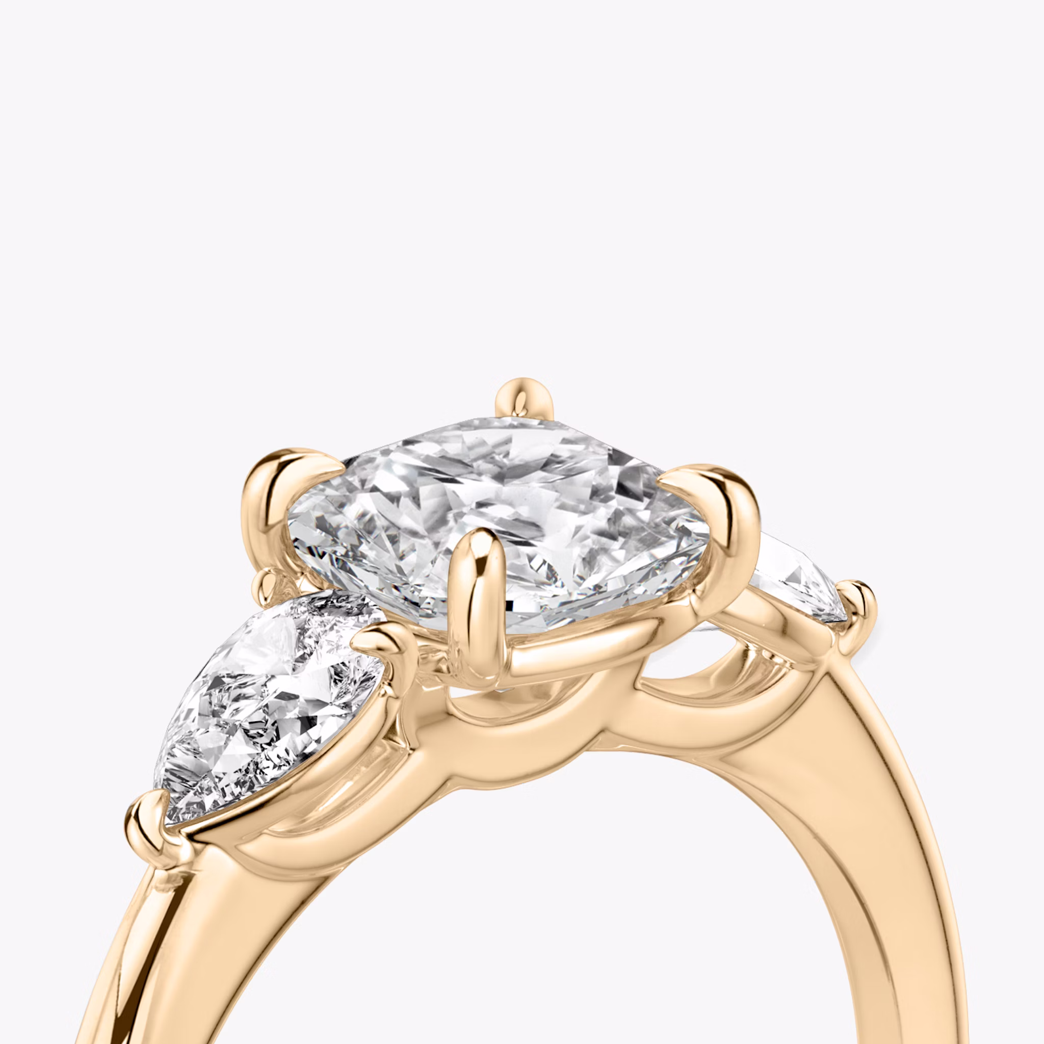 The Three Stone | Cushion | 14k | Rose Gold | bandAccent: Plain | sideStoneCarat: 0.25ct | sideStoneShape: Pear | diamondOrientation: vertical | caratWeight: other