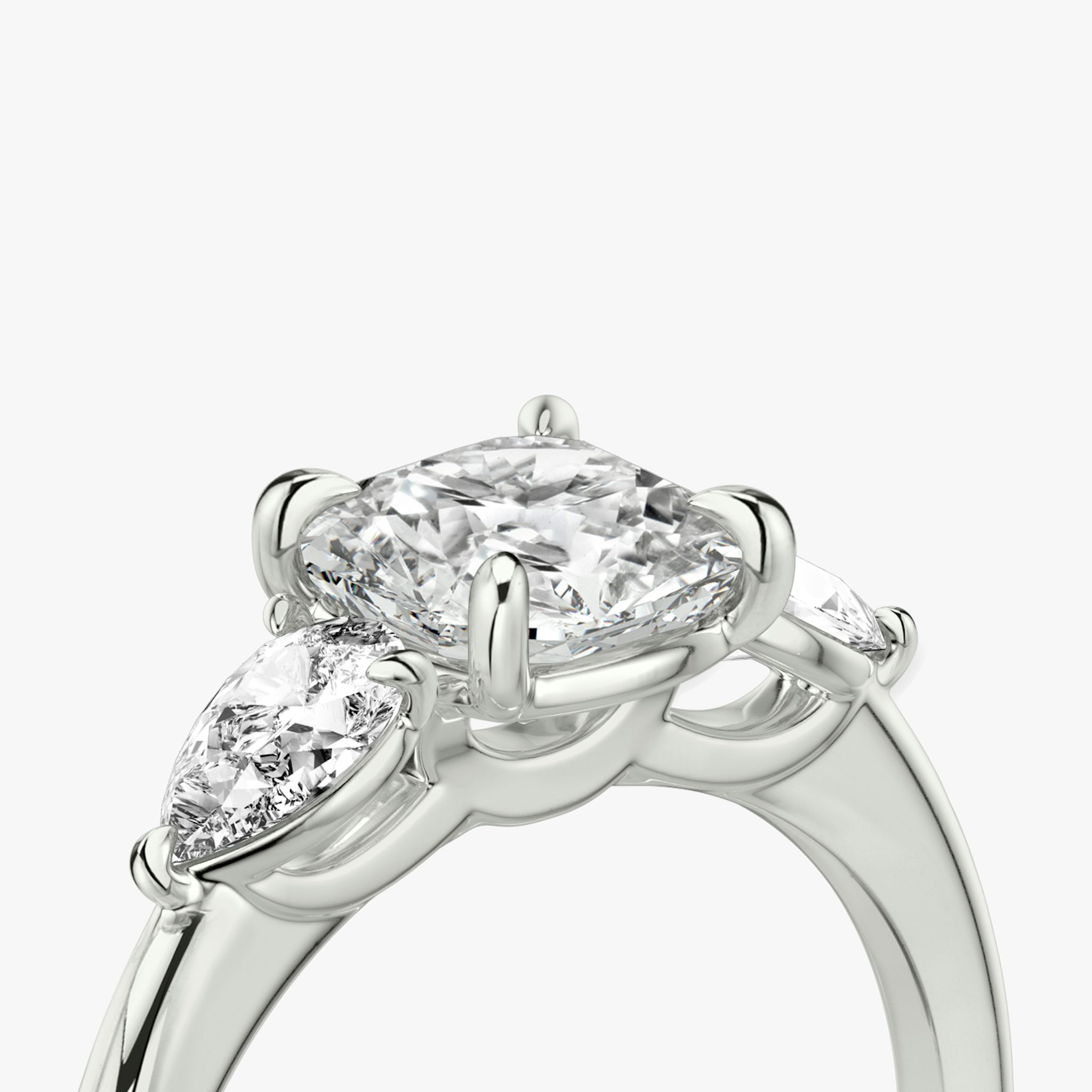 The Three Stone | Cushion | Platinum | bandAccent: Plain | sideStoneCarat: 0.25ct | sideStoneShape: Pear | diamondOrientation: vertical | caratWeight: other
