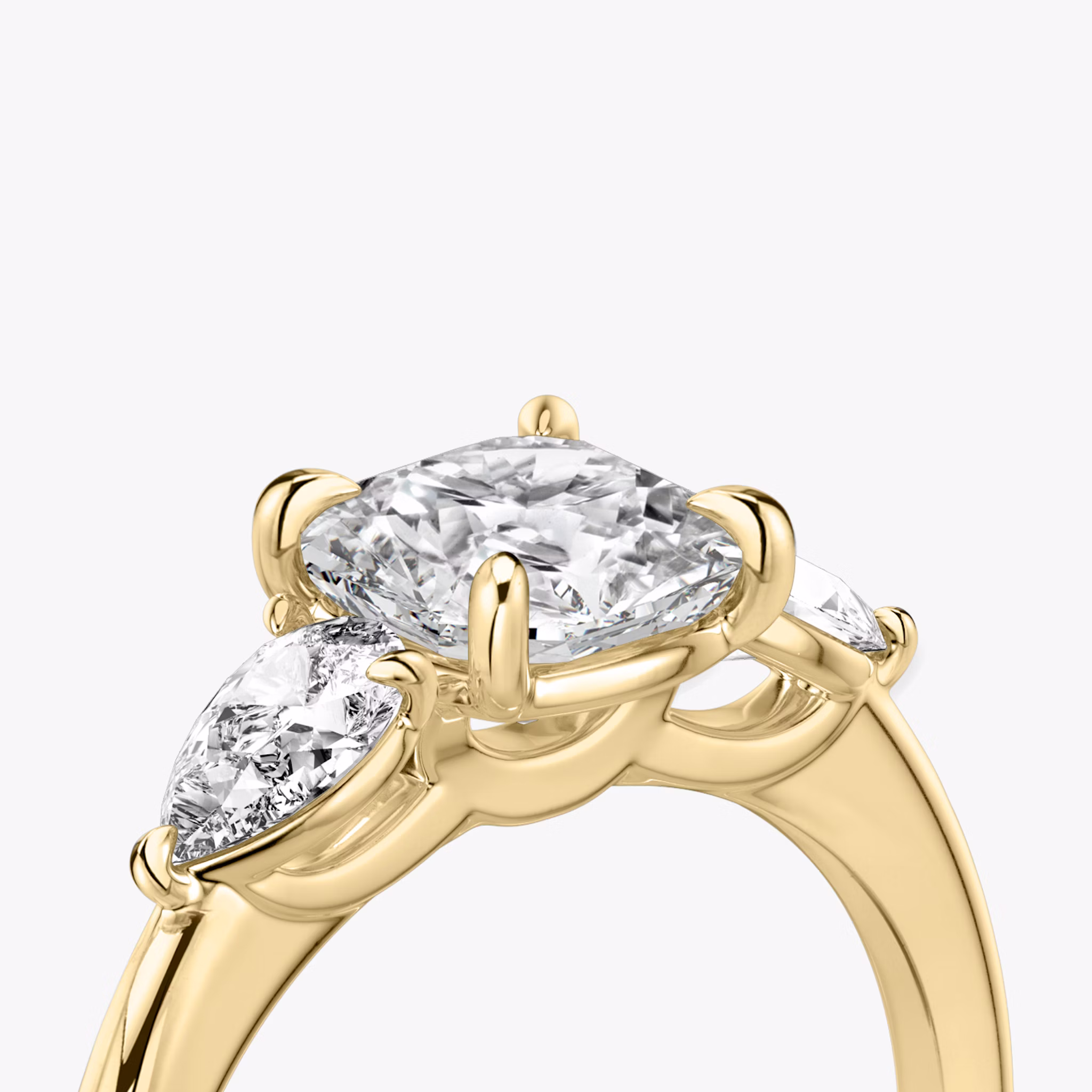 The Three Stone | Cushion | 18k | Yellow Gold | bandAccent: Plain | sideStoneCarat: 0.25ct | sideStoneShape: Pear | diamondOrientation: vertical | caratWeight: other