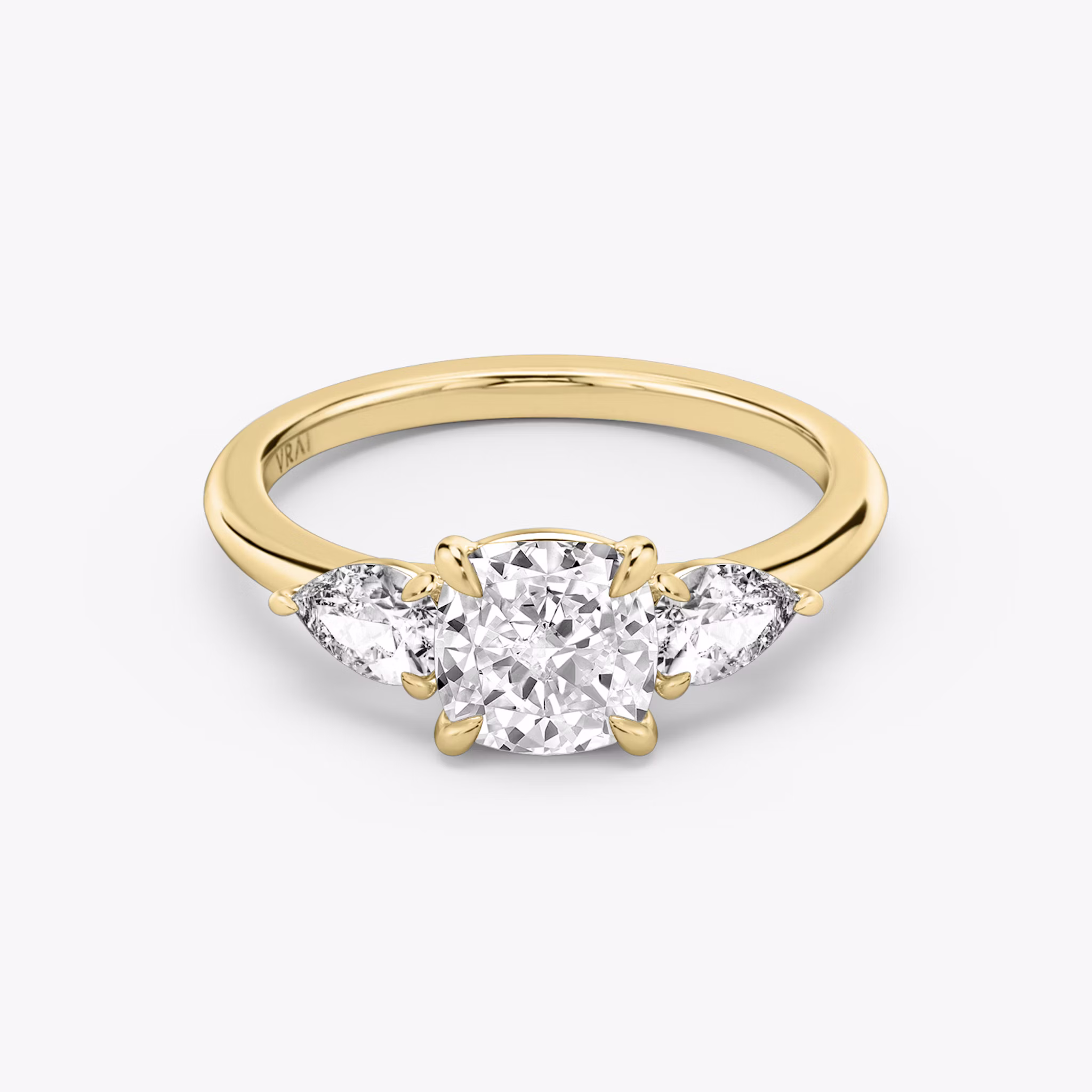 The Three Stone | Cushion | 18k | Yellow Gold | bandAccent: Plain | sideStoneCarat: 0.25ct | sideStoneShape: Pear | diamondOrientation: vertical | caratWeight: other