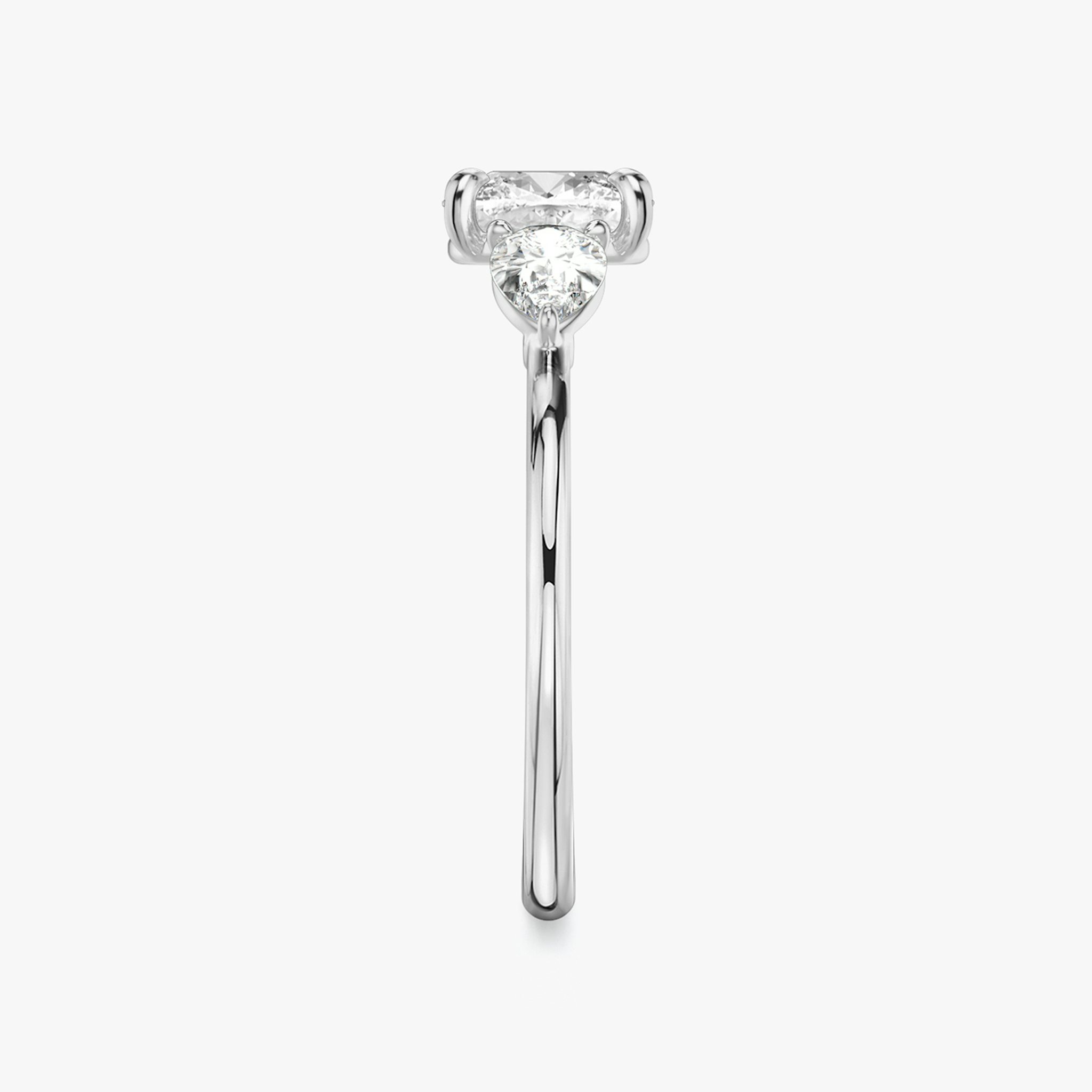 The Three Stone | Cushion | Platinum | bandAccent: Plain | sideStoneCarat: 0.25ct | sideStoneShape: Pear | diamondOrientation: vertical | caratWeight: other