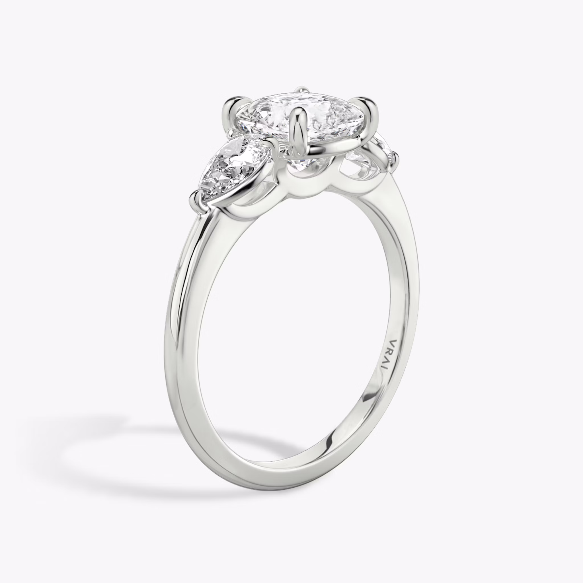 The Three Stone | Cushion | Platinum | bandAccent: Plain | sideStoneCarat: 0.25ct | sideStoneShape: Pear | diamondOrientation: vertical | caratWeight: other