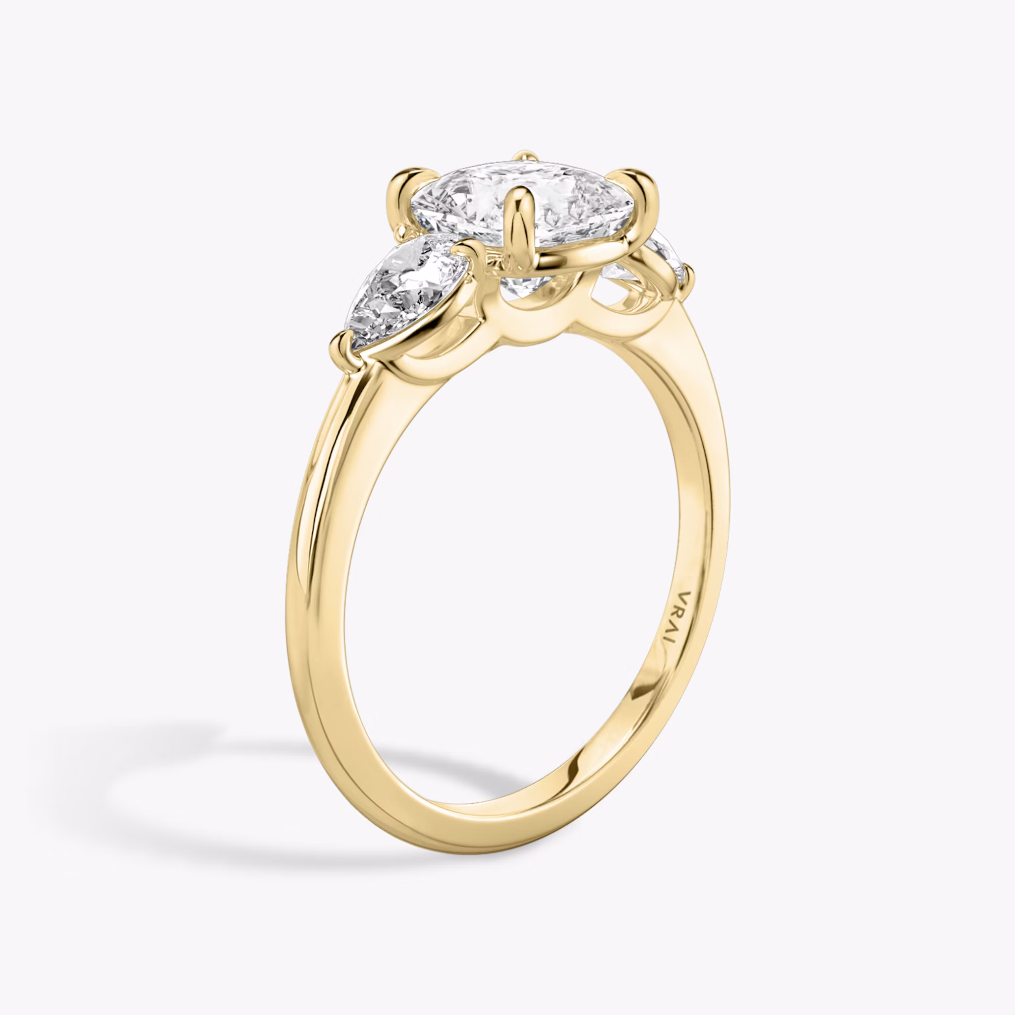 The Three Stone | Cushion | 18k | Yellow Gold | bandAccent: Plain | sideStoneCarat: 0.25ct | sideStoneShape: Pear | diamondOrientation: vertical | caratWeight: other