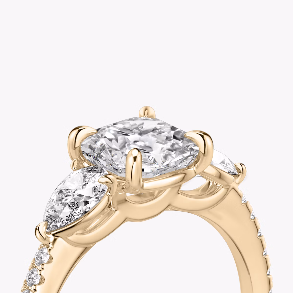 The Three Stone | Cushion | 14k | Rose Gold | bandAccent: Pavé | sideStoneCarat: 0.25ct | sideStoneShape: Pear | diamondOrientation: vertical | caratWeight: other