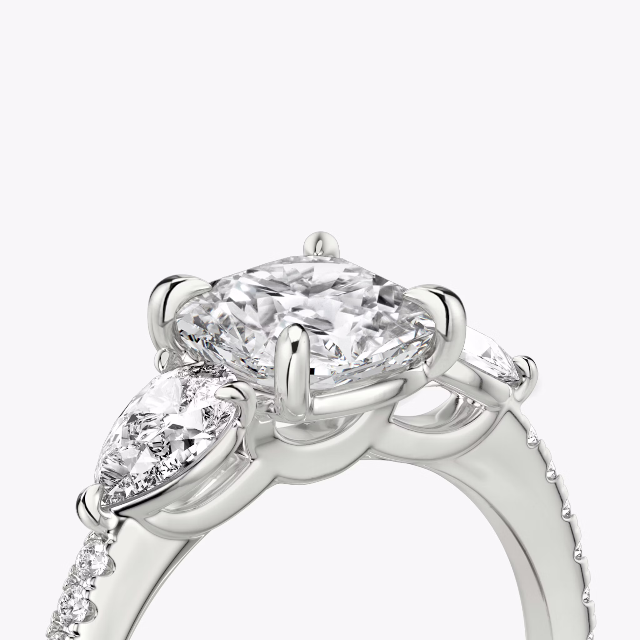 The Three Stone | Cushion | 18k | White Gold | bandAccent: Pavé | sideStoneCarat: 0.25ct | sideStoneShape: Pear | diamondOrientation: vertical | caratWeight: other