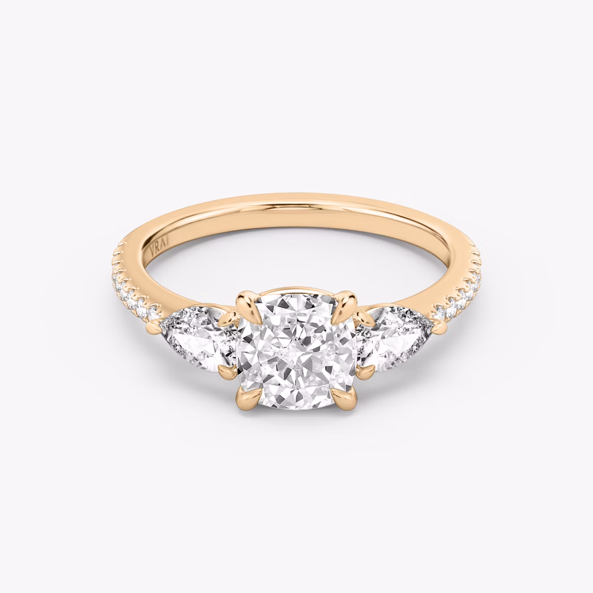 The Three Stone | Cushion | 14k | Rose Gold | bandAccent: Pavé | sideStoneCarat: 0.25ct | sideStoneShape: Pear | diamondOrientation: vertical | caratWeight: other