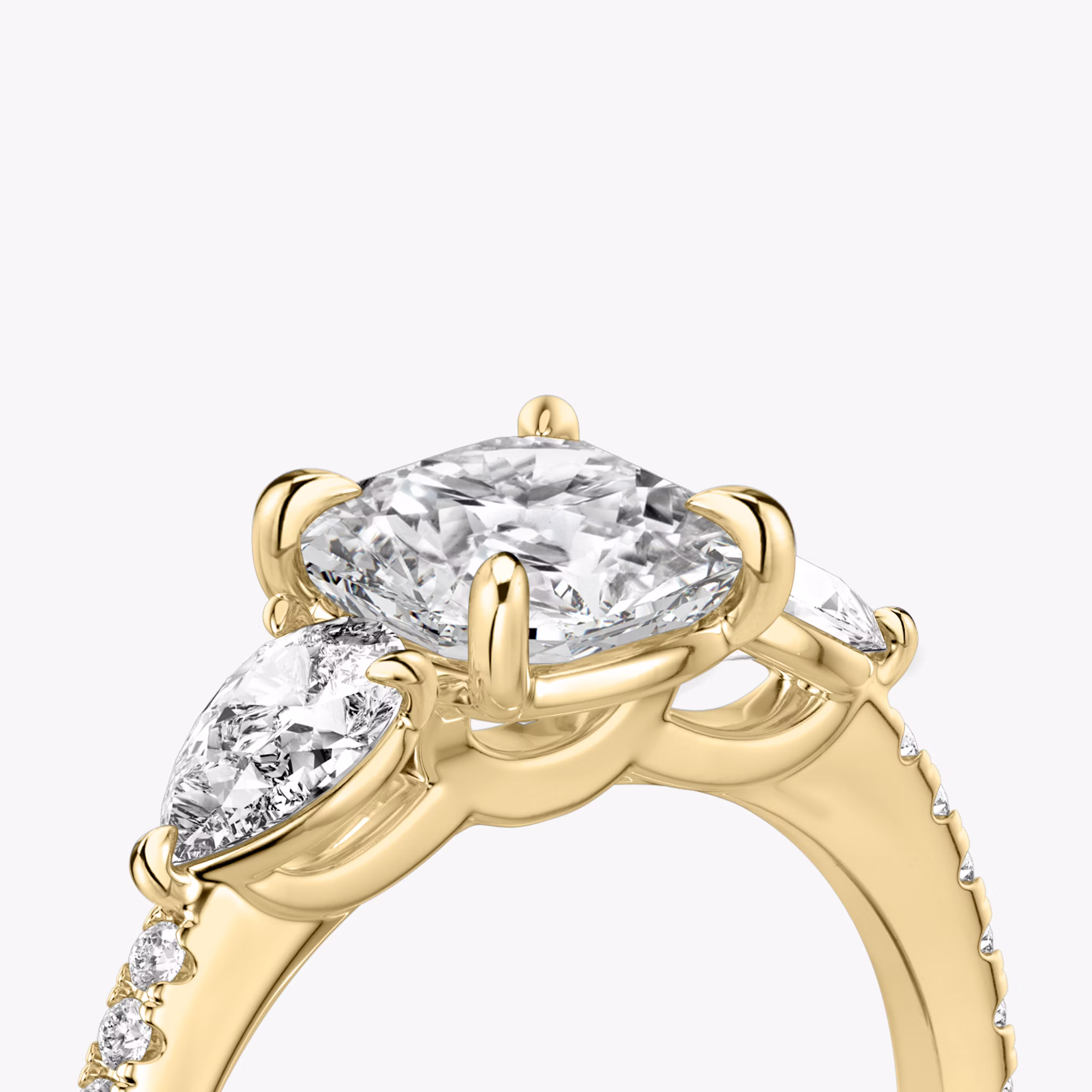 The Three Stone | Cushion | 18k | Yellow Gold | bandAccent: Pavé | sideStoneCarat: 0.25ct | sideStoneShape: Pear | diamondOrientation: vertical | caratWeight: other
