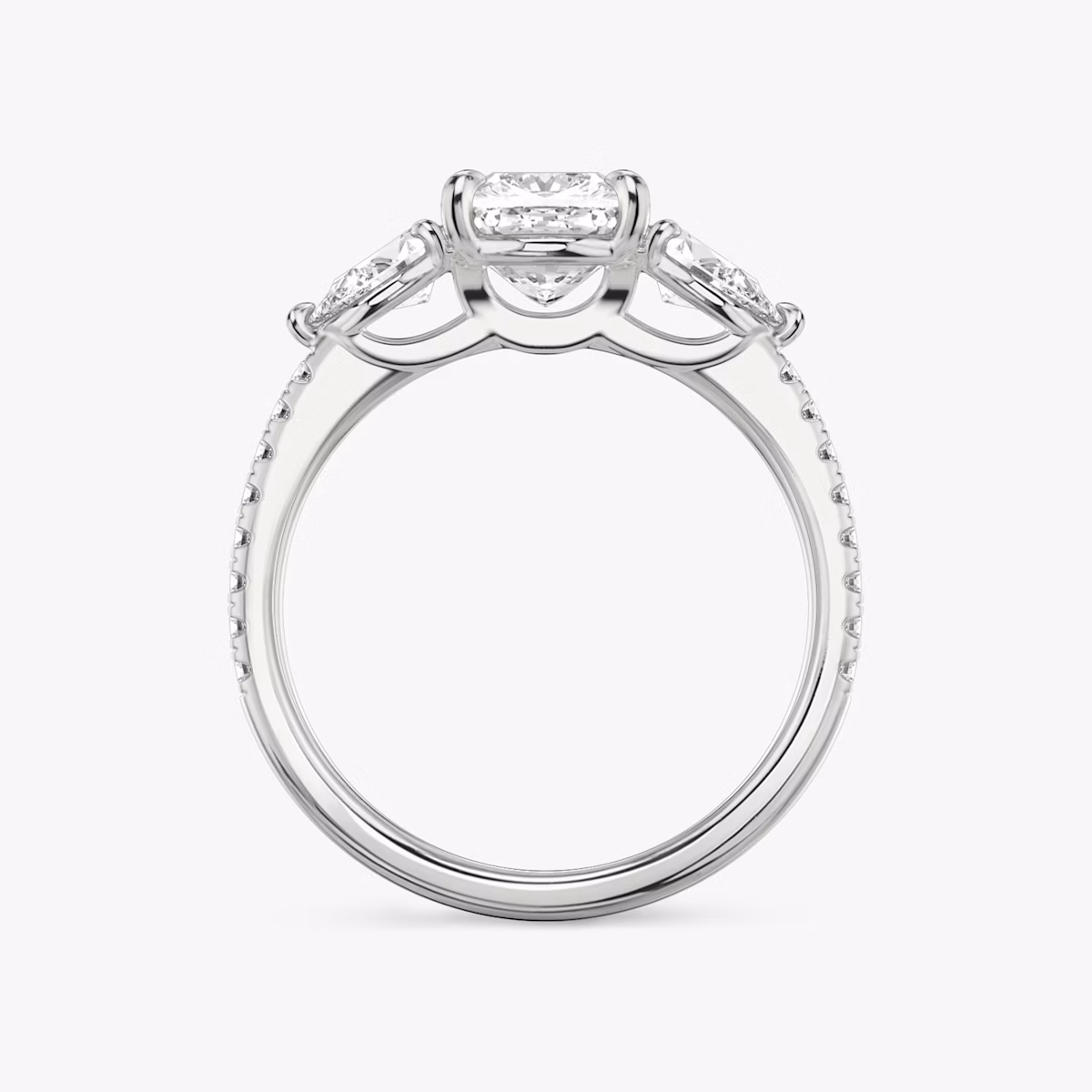 The Three Stone | Cushion | Platinum | bandAccent: Pavé | sideStoneCarat: 0.25ct | sideStoneShape: Pear | diamondOrientation: vertical | caratWeight: other