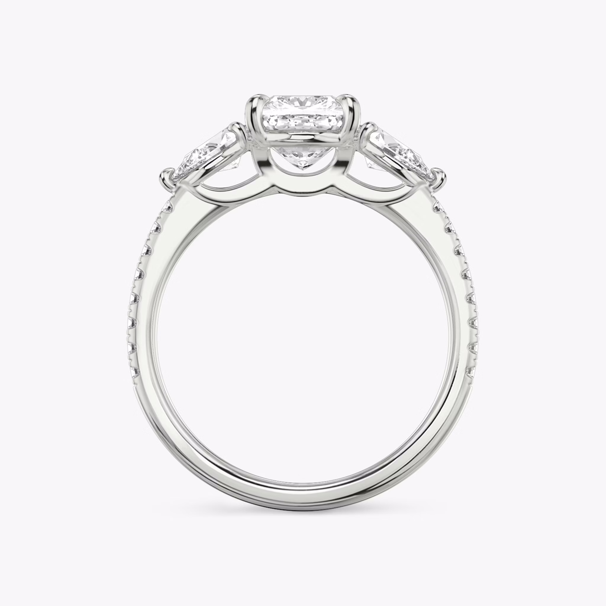 The Three Stone | Cushion | 18k | White Gold | bandAccent: Pavé | sideStoneCarat: 0.25ct | sideStoneShape: Pear | diamondOrientation: vertical | caratWeight: other