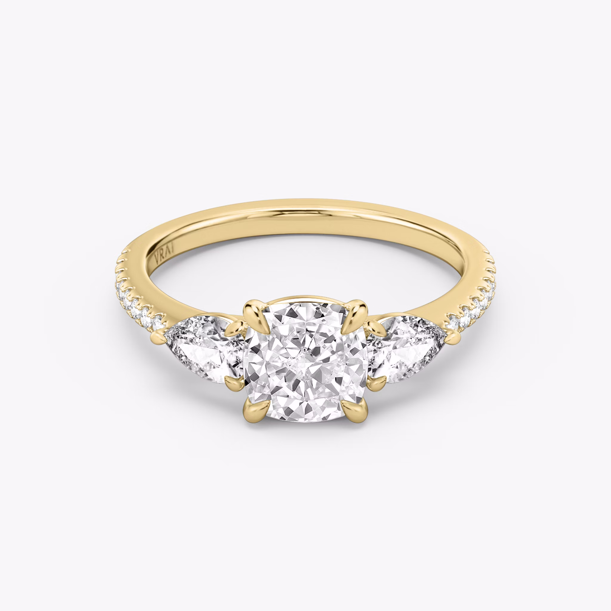 The Three Stone | Cushion | 18k | Yellow Gold | bandAccent: Pavé | sideStoneCarat: 0.25ct | sideStoneShape: Pear | diamondOrientation: vertical | caratWeight: other