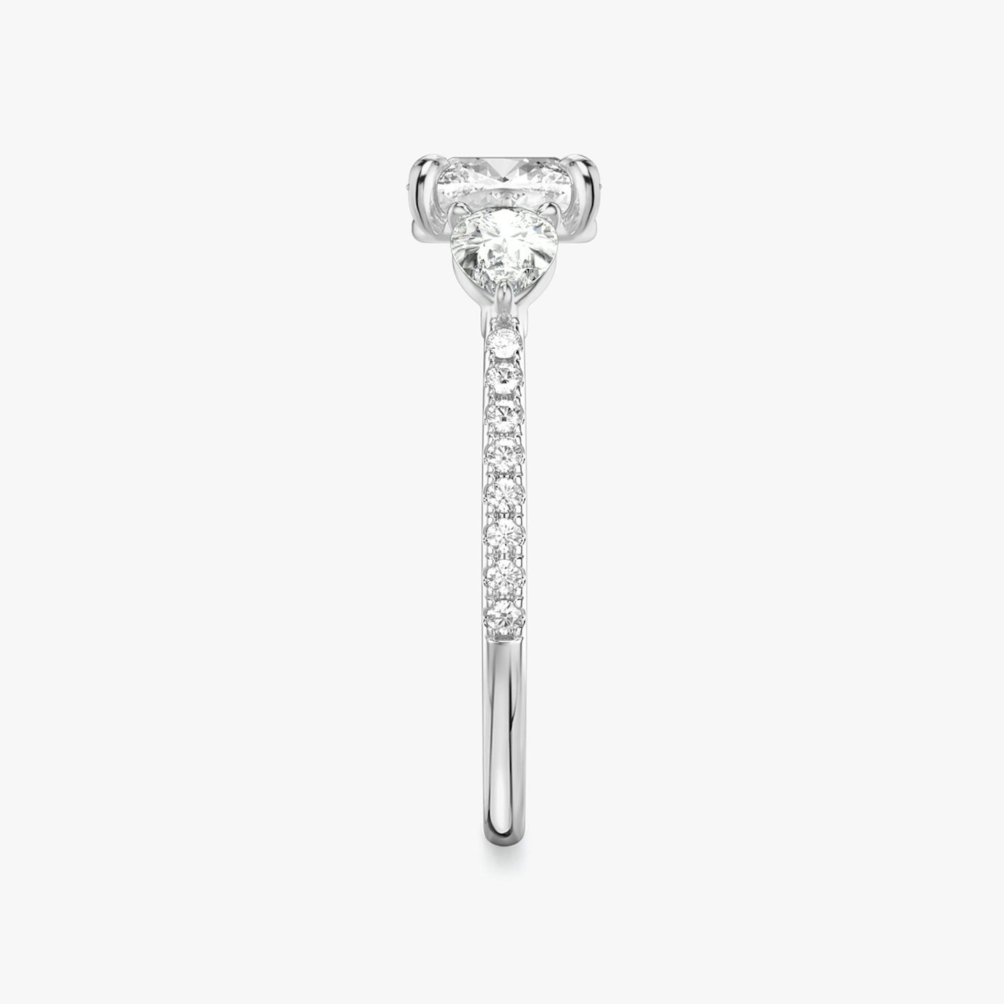 The Three Stone | Cushion | Platinum | bandAccent: Pavé | sideStoneCarat: 0.25ct | sideStoneShape: Pear | diamondOrientation: vertical | caratWeight: other