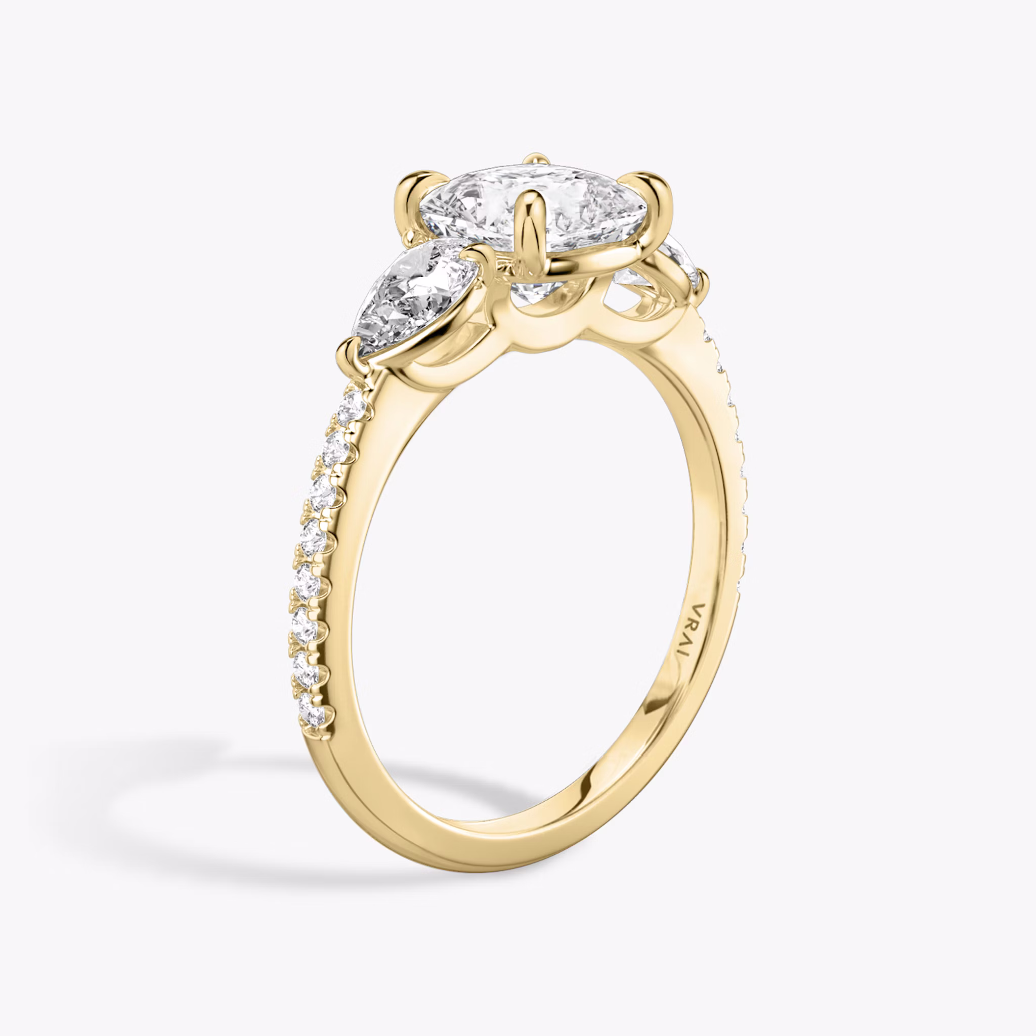 The Three Stone | Cushion | 18k | Yellow Gold | bandAccent: Pavé | sideStoneCarat: 0.25ct | sideStoneShape: Pear | diamondOrientation: vertical | caratWeight: other
