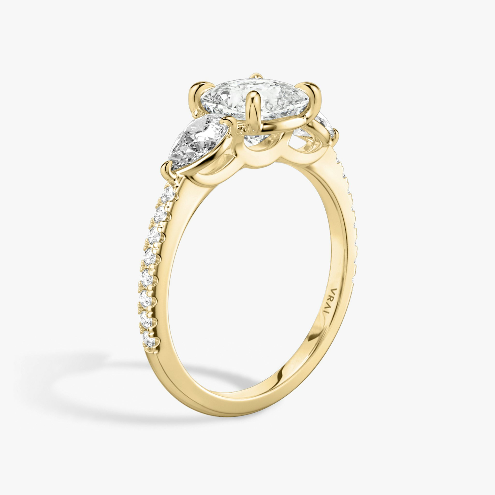 The Three Stone | Cushion | 18k | Yellow Gold | bandAccent: Pavé | sideStoneCarat: 0.25ct | sideStoneShape: Pear | diamondOrientation: vertical | caratWeight: other