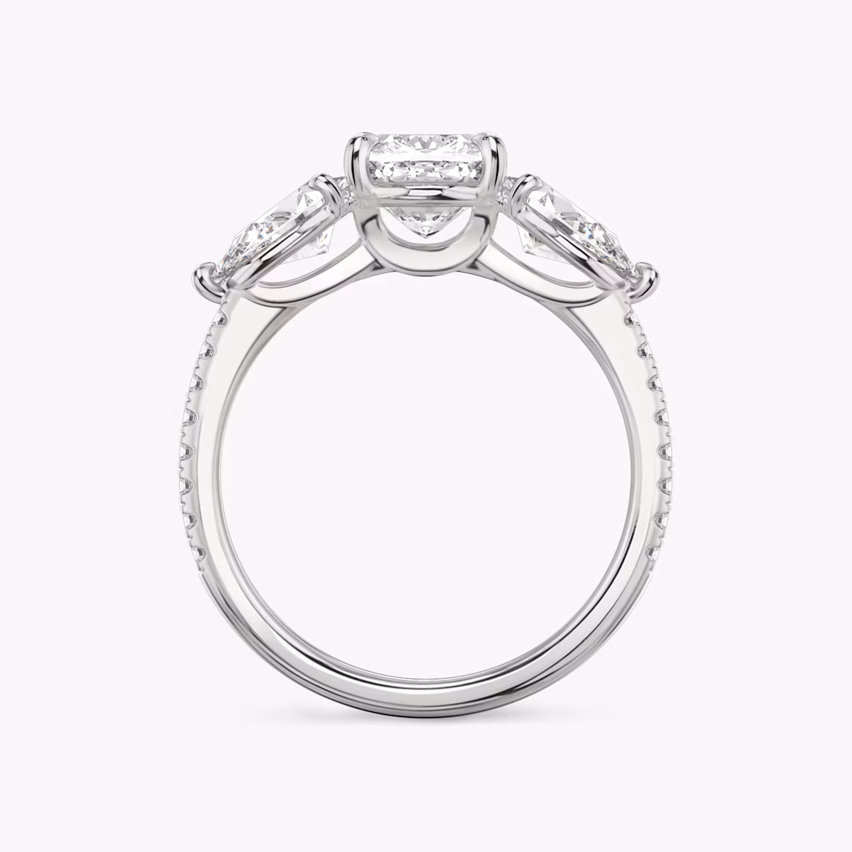 The Three Stone | Cushion | Platinum | bandAccent: Pavé | sideStoneCarat: 0.50ct | sideStoneShape: Pear | diamondOrientation: vertical | caratWeight: other