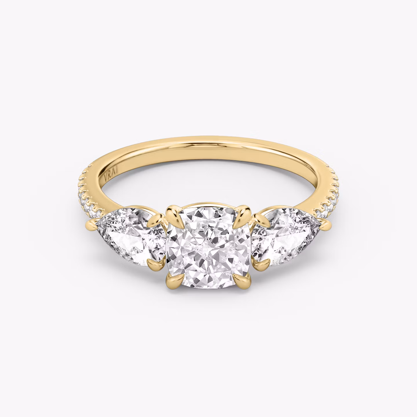 The Three Stone | Cushion | 18k | Yellow Gold | bandAccent: Pavé | sideStoneCarat: 0.50ct | sideStoneShape: Pear | diamondOrientation: vertical | caratWeight: other