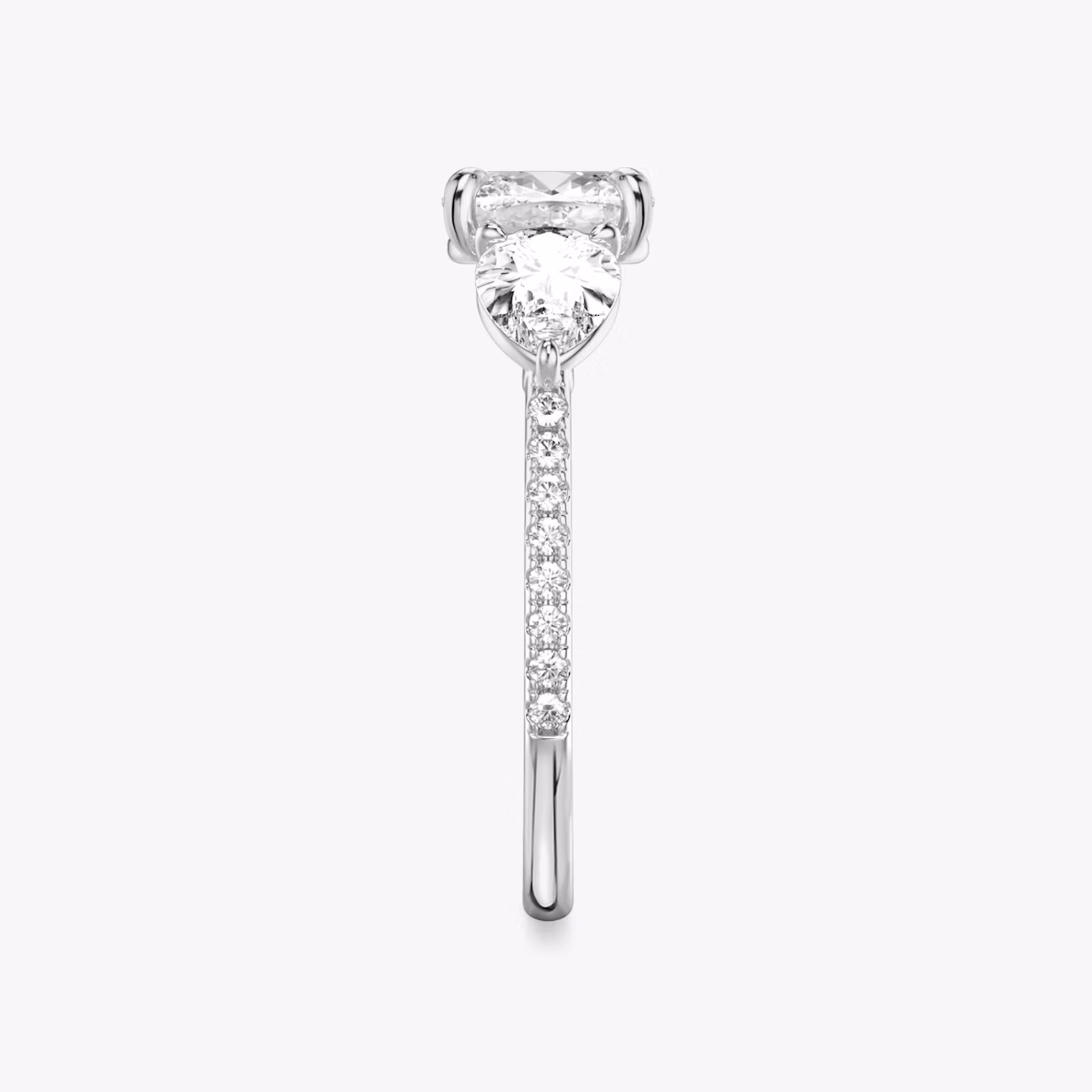 The Three Stone | Cushion | Platinum | bandAccent: Pavé | sideStoneCarat: 0.50ct | sideStoneShape: Pear | diamondOrientation: vertical | caratWeight: other