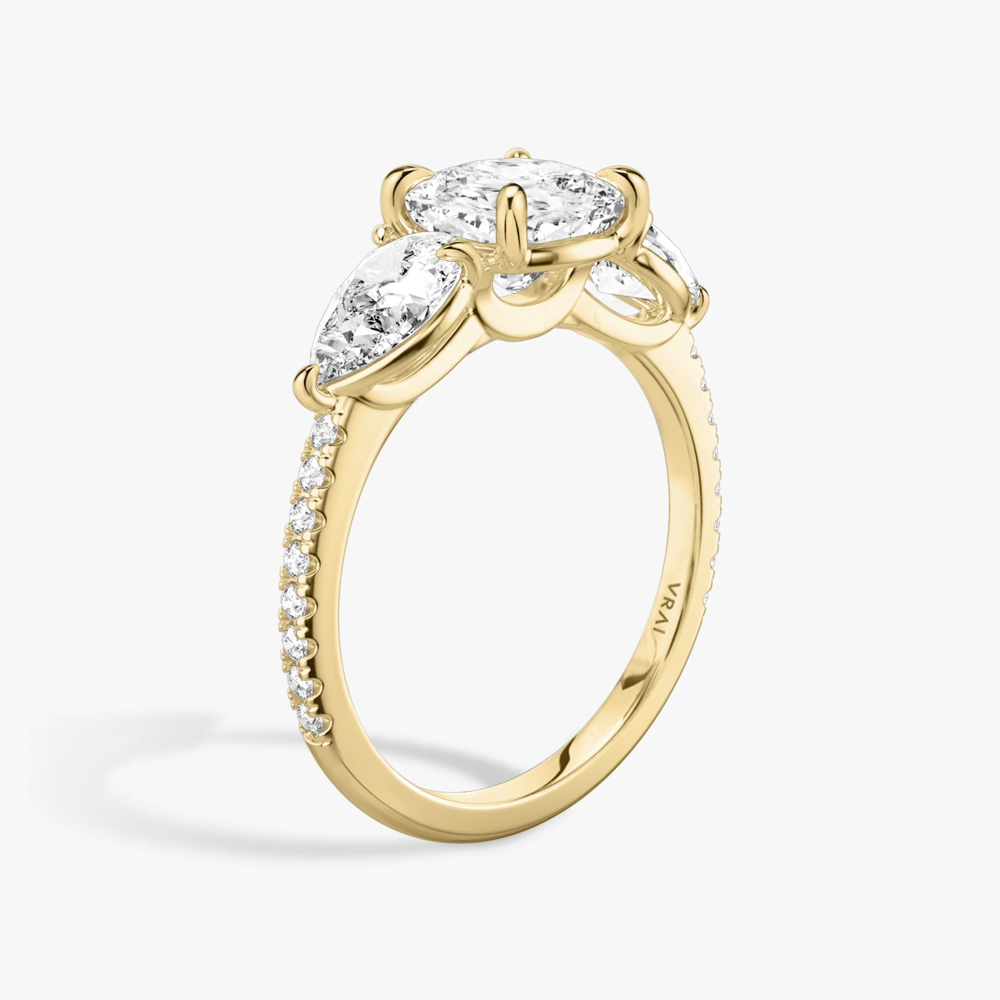 The Three Stone | Cushion | 18k | Yellow Gold | bandAccent: Pavé | sideStoneCarat: 0.50ct | sideStoneShape: Pear | diamondOrientation: vertical | caratWeight: other