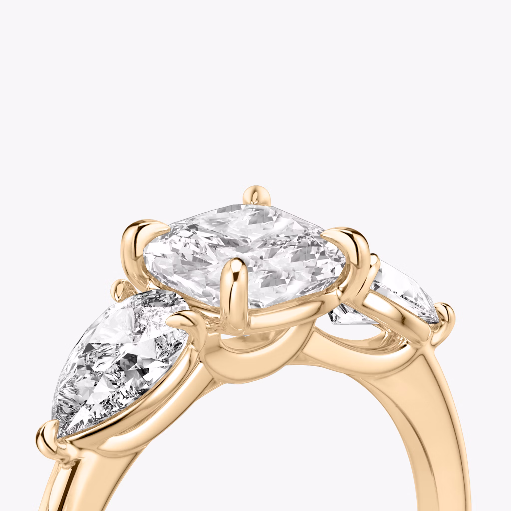 The Three Stone | Cushion | 14k | Rose Gold | bandAccent: Plain | sideStoneCarat: 0.50ct | sideStoneShape: Pear | diamondOrientation: vertical | caratWeight: other