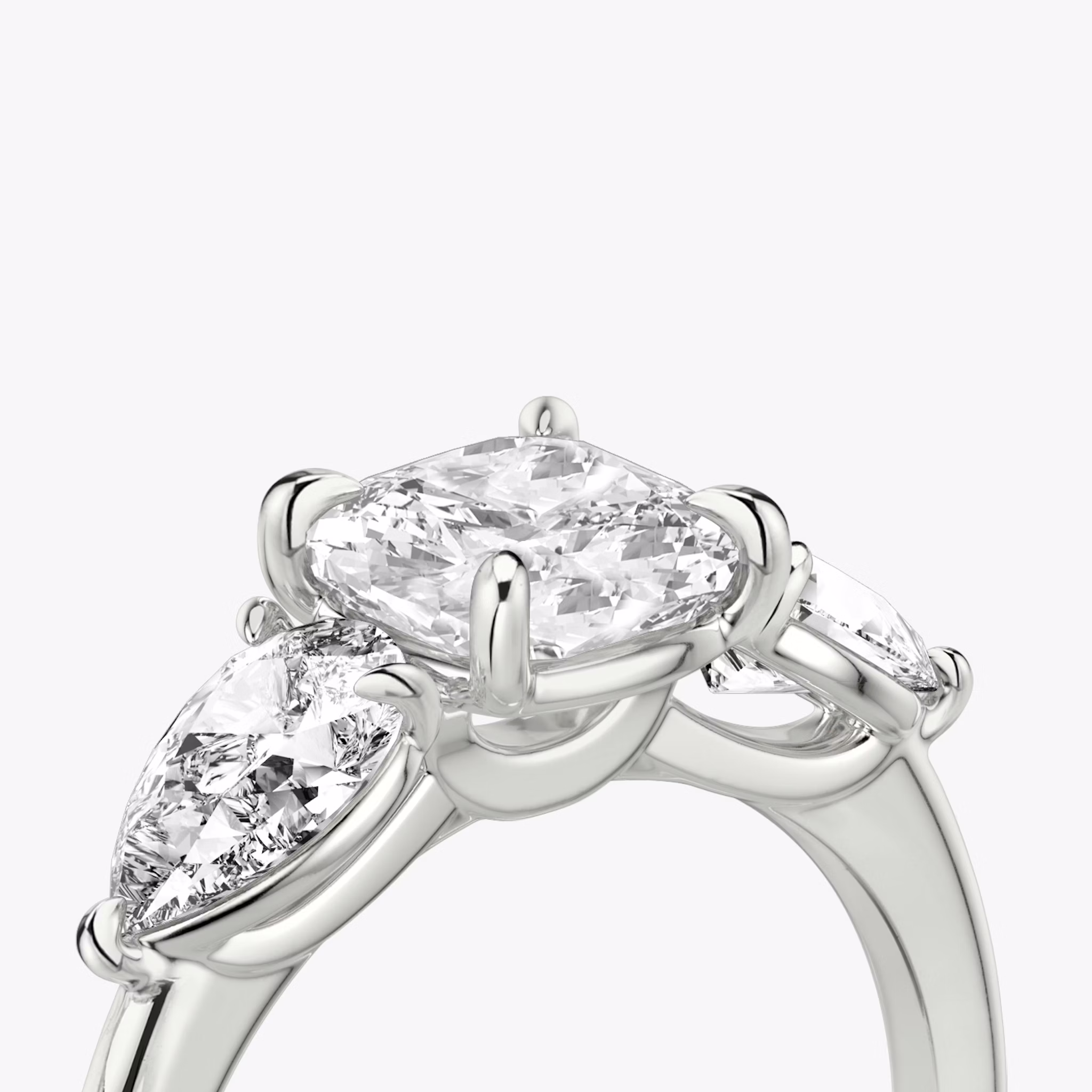 The Three Stone | Cushion | 18k | White Gold | bandAccent: Plain | sideStoneCarat: 0.50ct | sideStoneShape: Pear | diamondOrientation: vertical | caratWeight: other