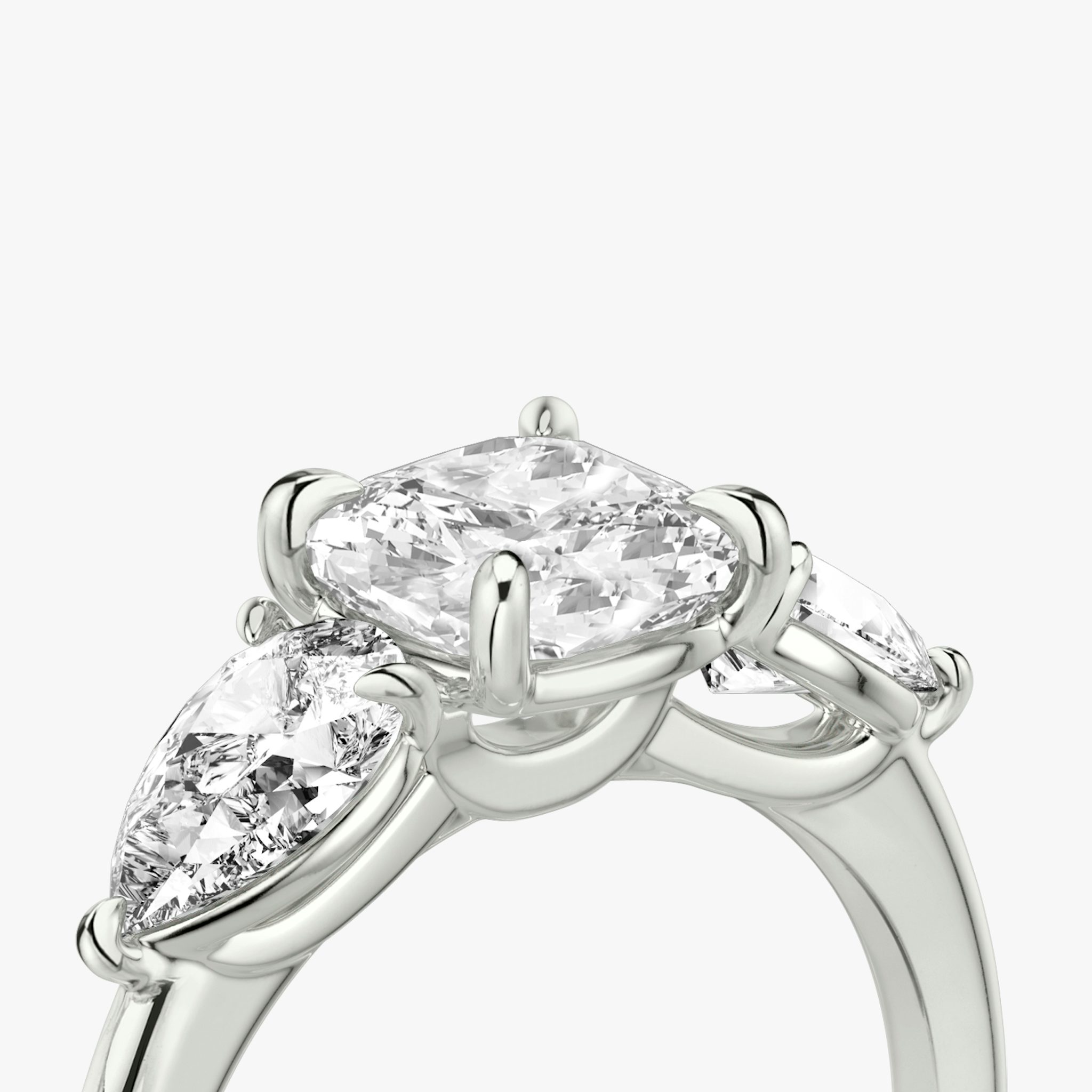 The Three Stone | Cushion | 18k | White Gold | bandAccent: Plain | sideStoneCarat: 0.50ct | sideStoneShape: Pear | diamondOrientation: vertical | caratWeight: other