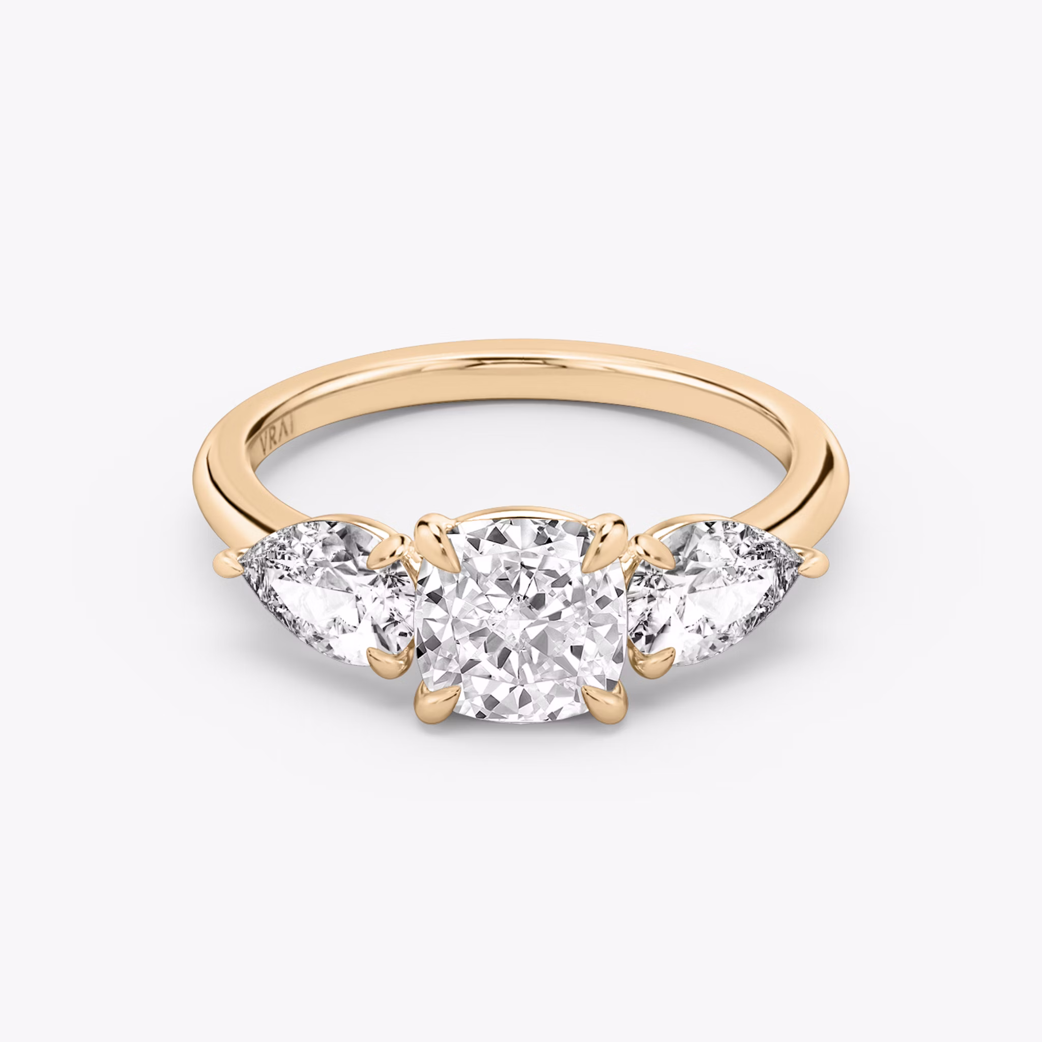 The Three Stone | Cushion | 14k | Rose Gold | bandAccent: Plain | sideStoneCarat: 0.50ct | sideStoneShape: Pear | diamondOrientation: vertical | caratWeight: other