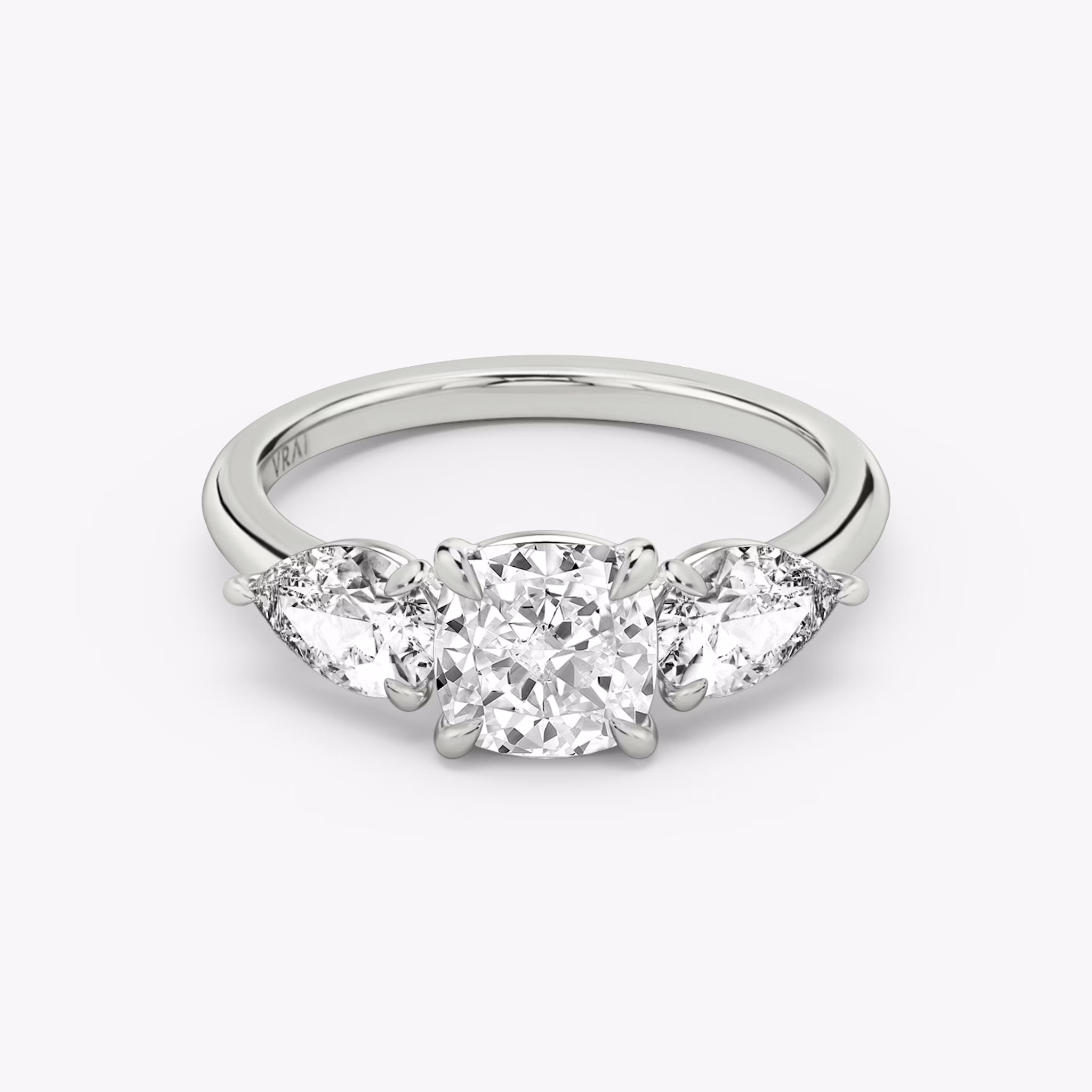 The Three Stone | Cushion | 18k | White Gold | bandAccent: Plain | sideStoneCarat: 0.50ct | sideStoneShape: Pear | diamondOrientation: vertical | caratWeight: other