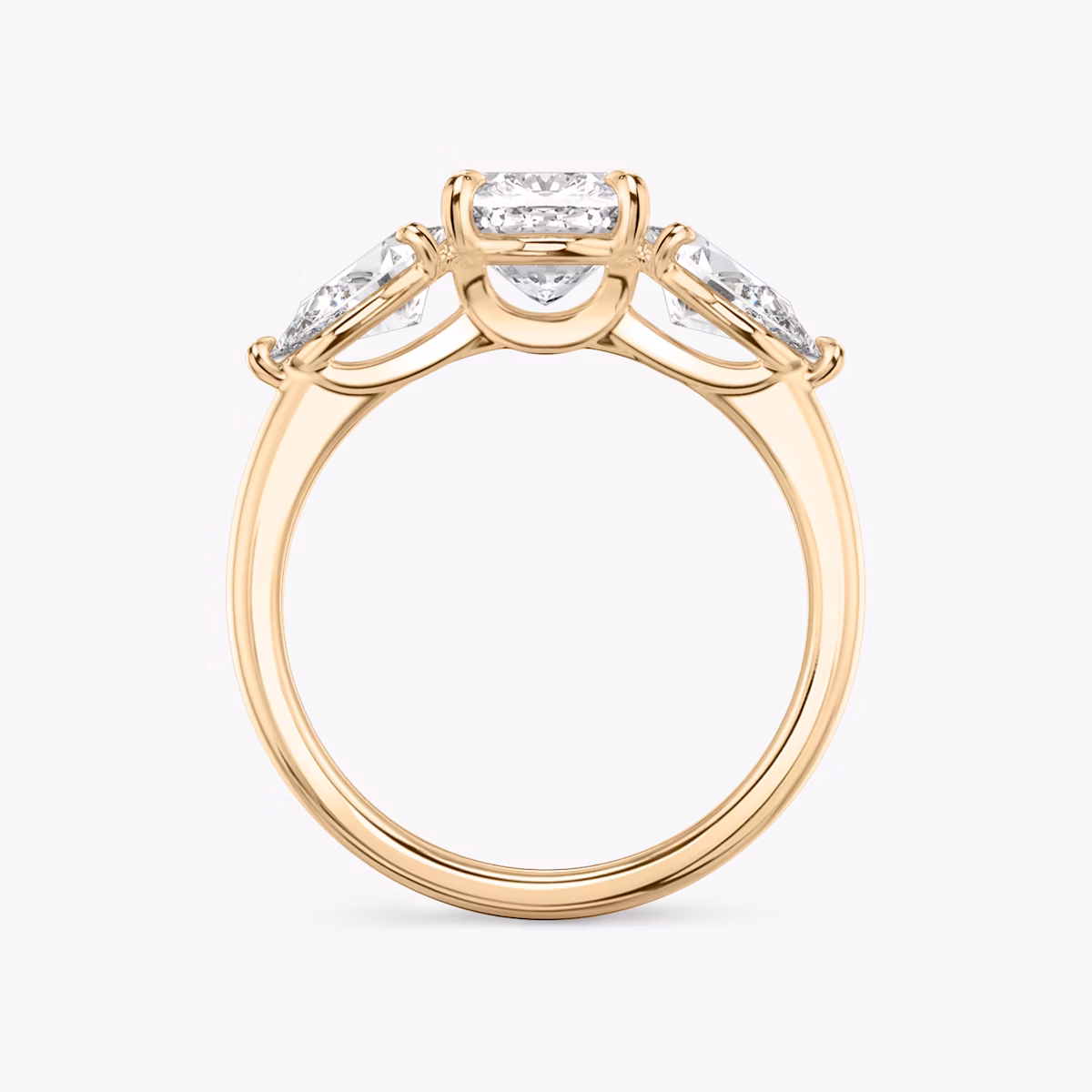 The Three Stone | Cushion | 14k | Rose Gold | bandAccent: Plain | sideStoneCarat: 0.50ct | sideStoneShape: Pear | diamondOrientation: vertical | caratWeight: other