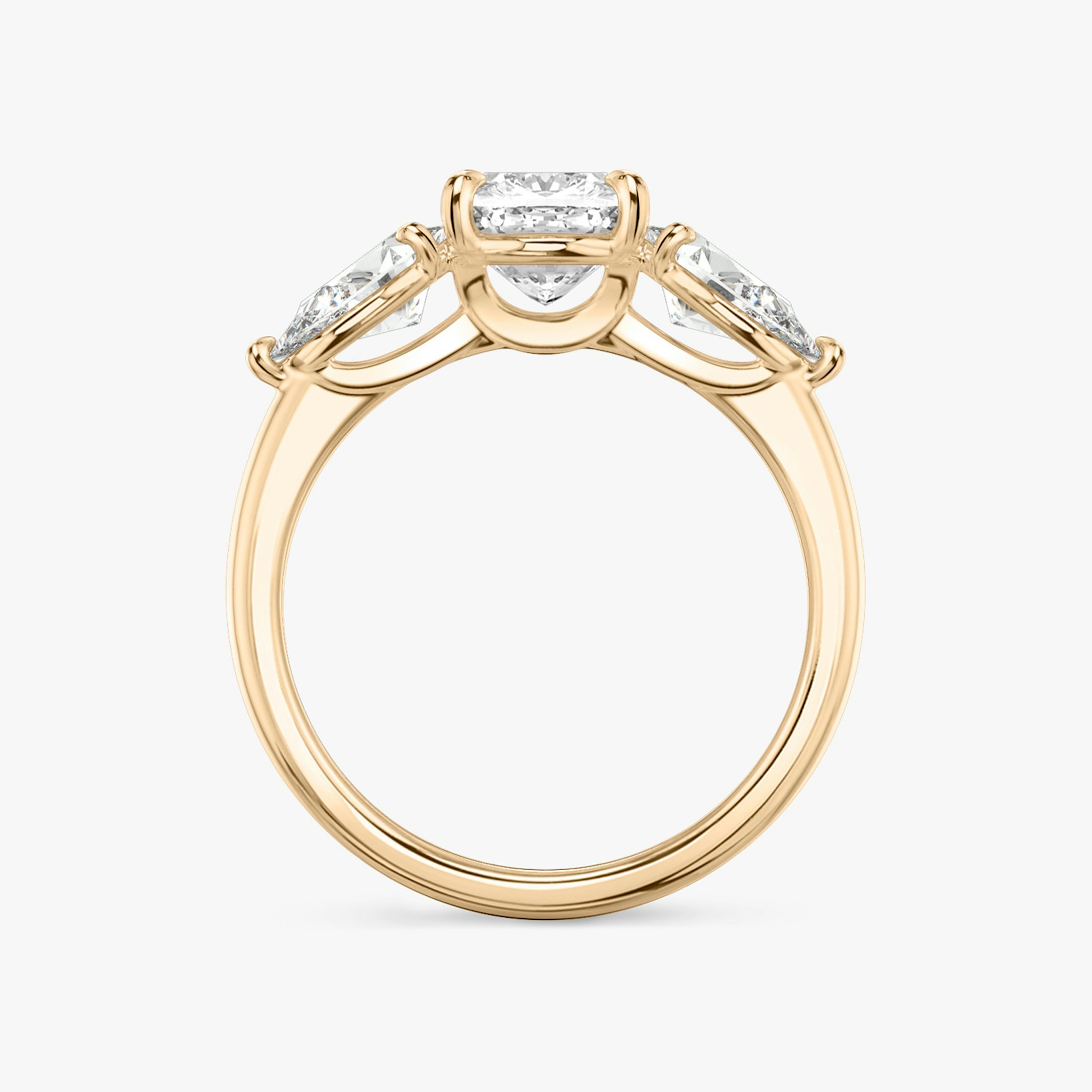 The Three Stone | Cushion | 14k | Rose Gold | bandAccent: Plain | sideStoneCarat: 0.50ct | sideStoneShape: Pear | diamondOrientation: vertical | caratWeight: other