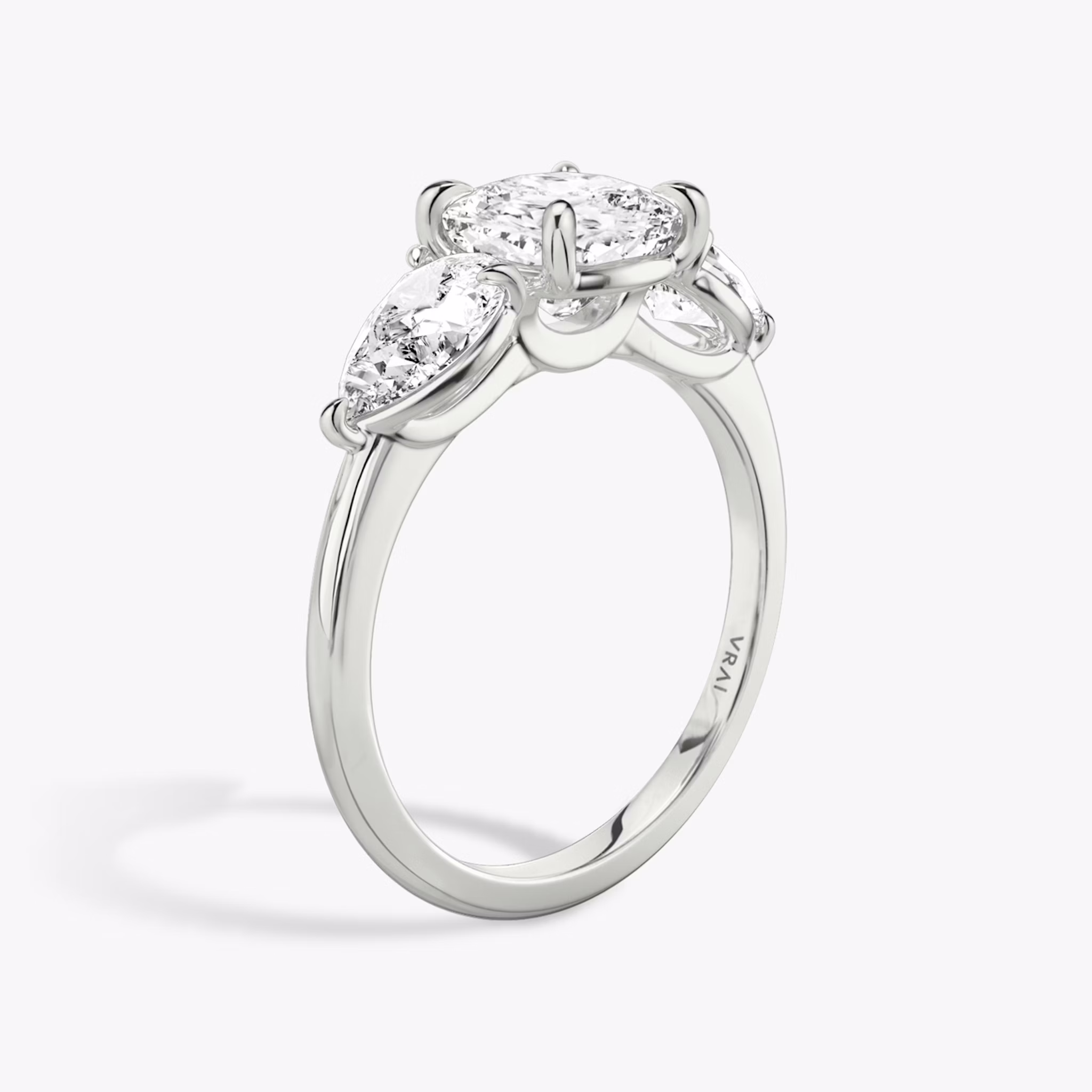 The Three Stone | Cushion | 18k | White Gold | bandAccent: Plain | sideStoneCarat: 0.50ct | sideStoneShape: Pear | diamondOrientation: vertical | caratWeight: other