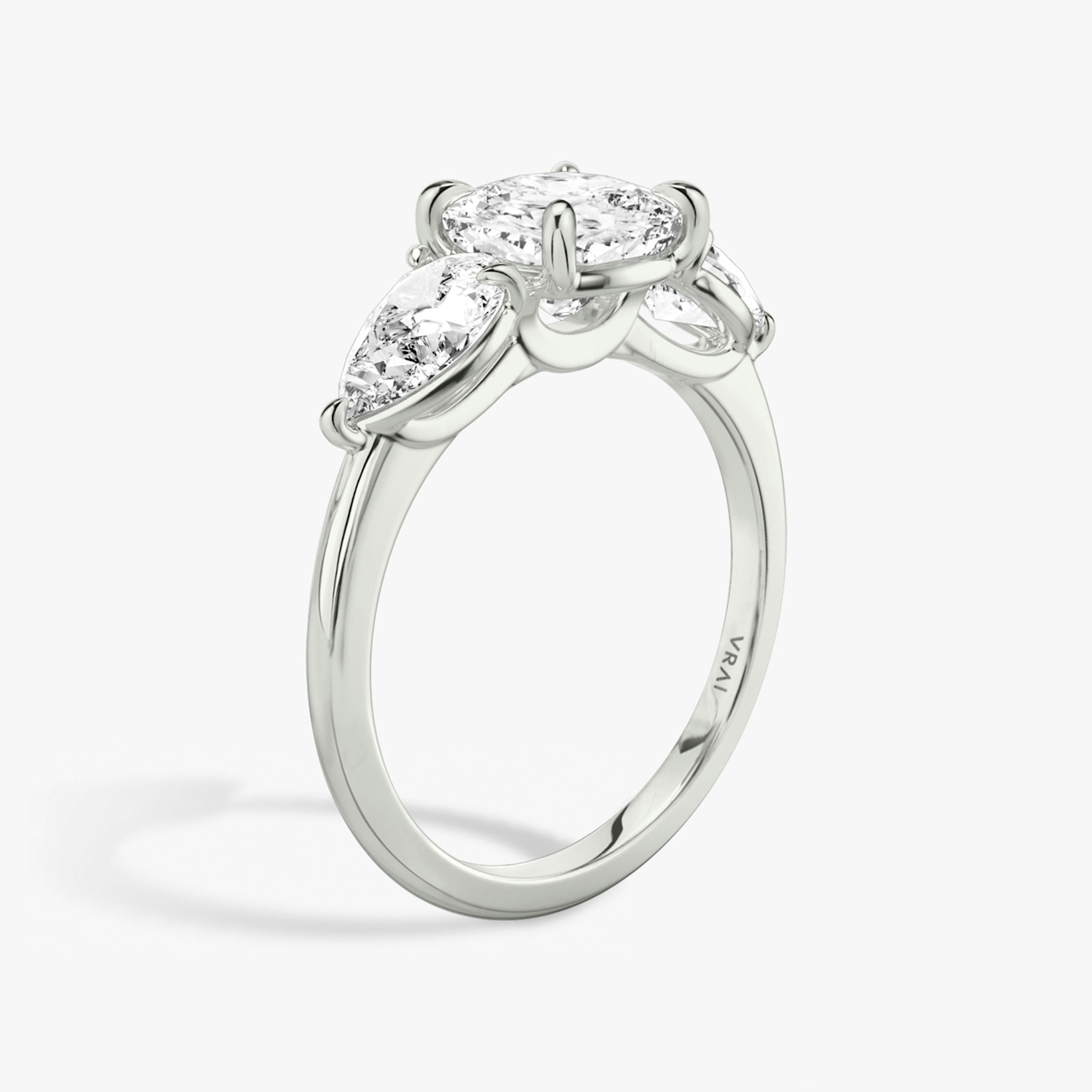 The Three Stone | Cushion | 18k | White Gold | bandAccent: Plain | sideStoneCarat: 0.50ct | sideStoneShape: Pear | diamondOrientation: vertical | caratWeight: other