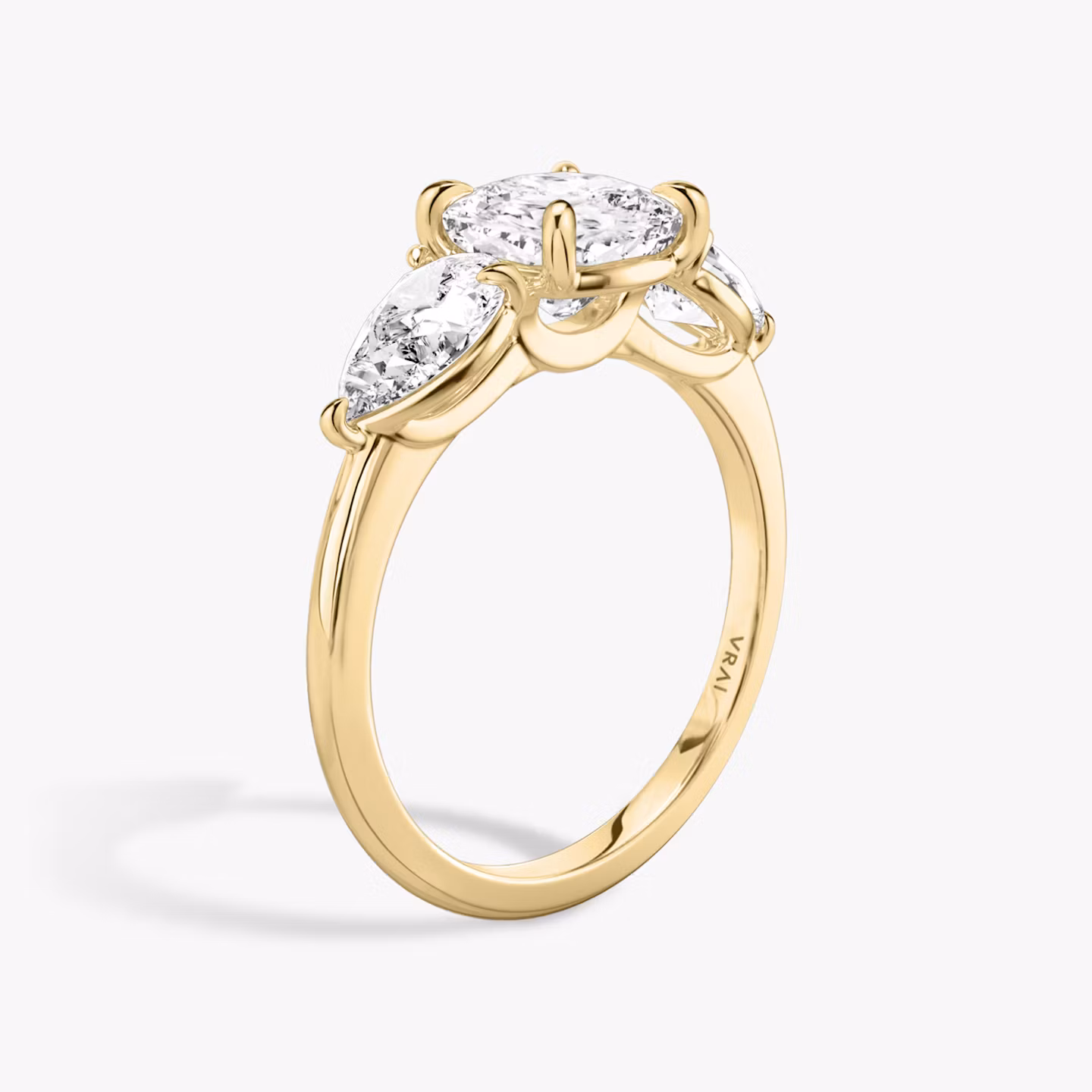 The Three Stone | Cushion | 18k | Yellow Gold | bandAccent: Plain | sideStoneCarat: 0.50ct | sideStoneShape: Pear | diamondOrientation: vertical | caratWeight: other