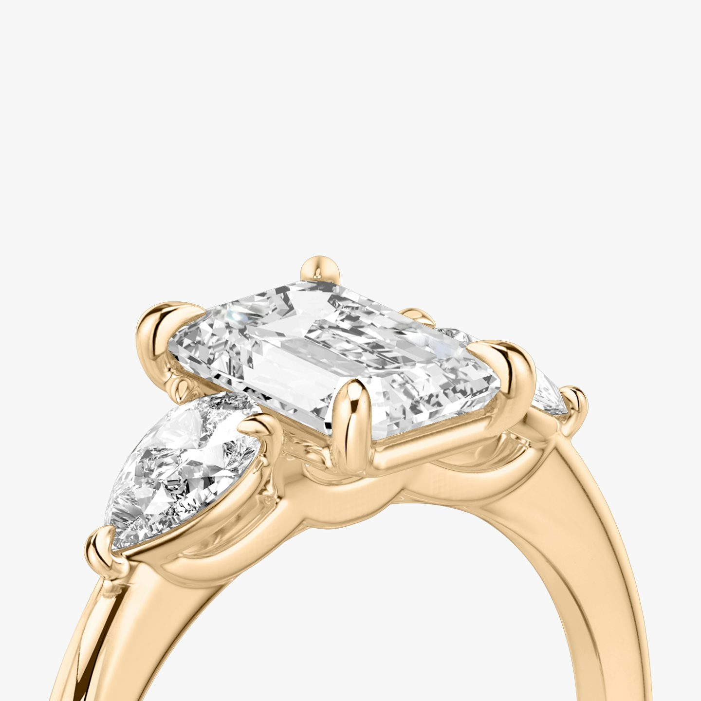 The Three Stone | Emerald | 14k | Rose Gold | bandAccent: Plain | sideStoneCarat: 0.25ct | sideStoneShape: Pear | diamondOrientation: vertical | caratWeight: other