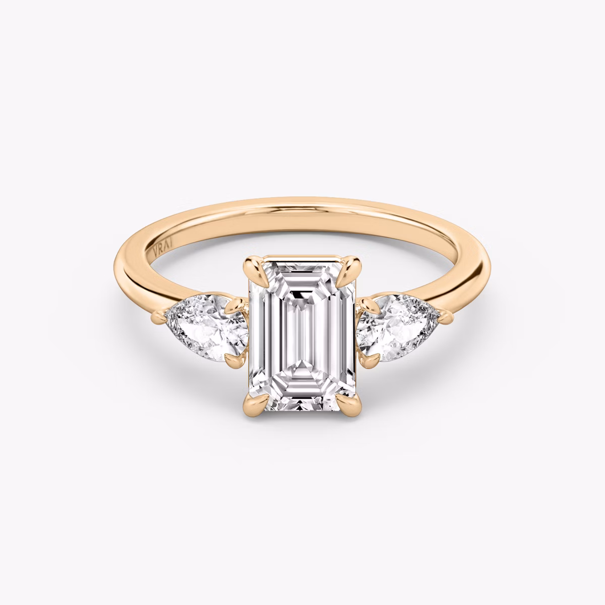 The Three Stone | Emerald | 14k | Rose Gold | bandAccent: Plain | sideStoneCarat: 0.25ct | sideStoneShape: Pear | diamondOrientation: vertical | caratWeight: other