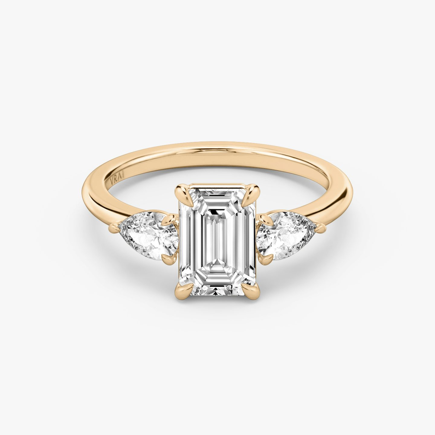 The Three Stone | Emerald | 14k | Rose Gold | bandAccent: Plain | sideStoneCarat: 0.25ct | sideStoneShape: Pear | diamondOrientation: vertical | caratWeight: other