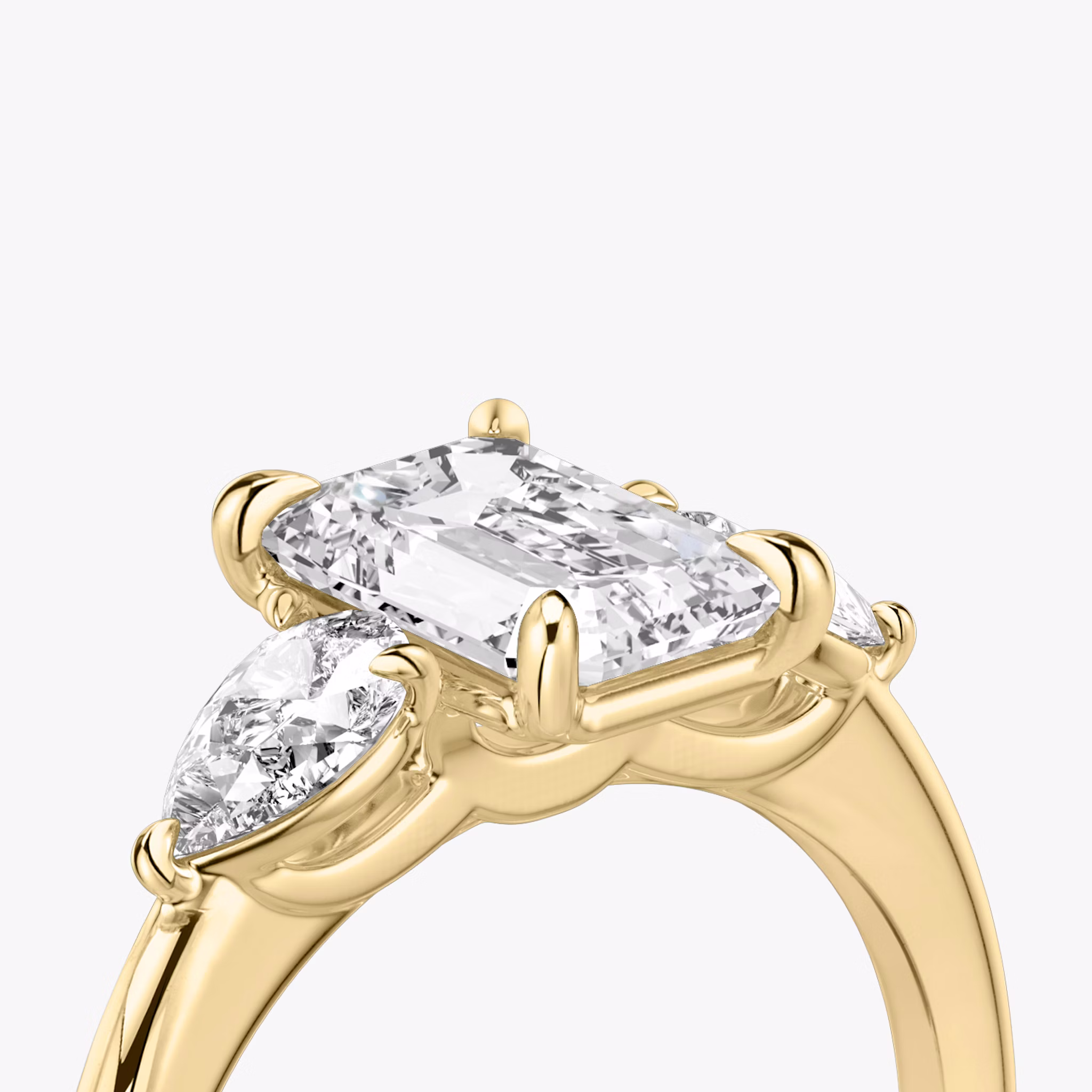 The Three Stone | Emerald | 18k | Yellow Gold | bandAccent: Plain | sideStoneCarat: 0.25ct | sideStoneShape: Pear | diamondOrientation: vertical | caratWeight: other