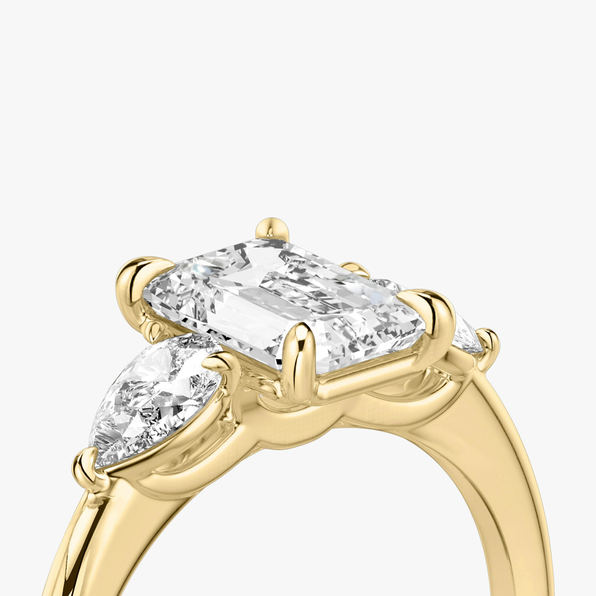 The Three Stone | Emerald | 18k | Yellow Gold | bandAccent: Plain | sideStoneCarat: 0.25ct | sideStoneShape: Pear | diamondOrientation: vertical | caratWeight: other