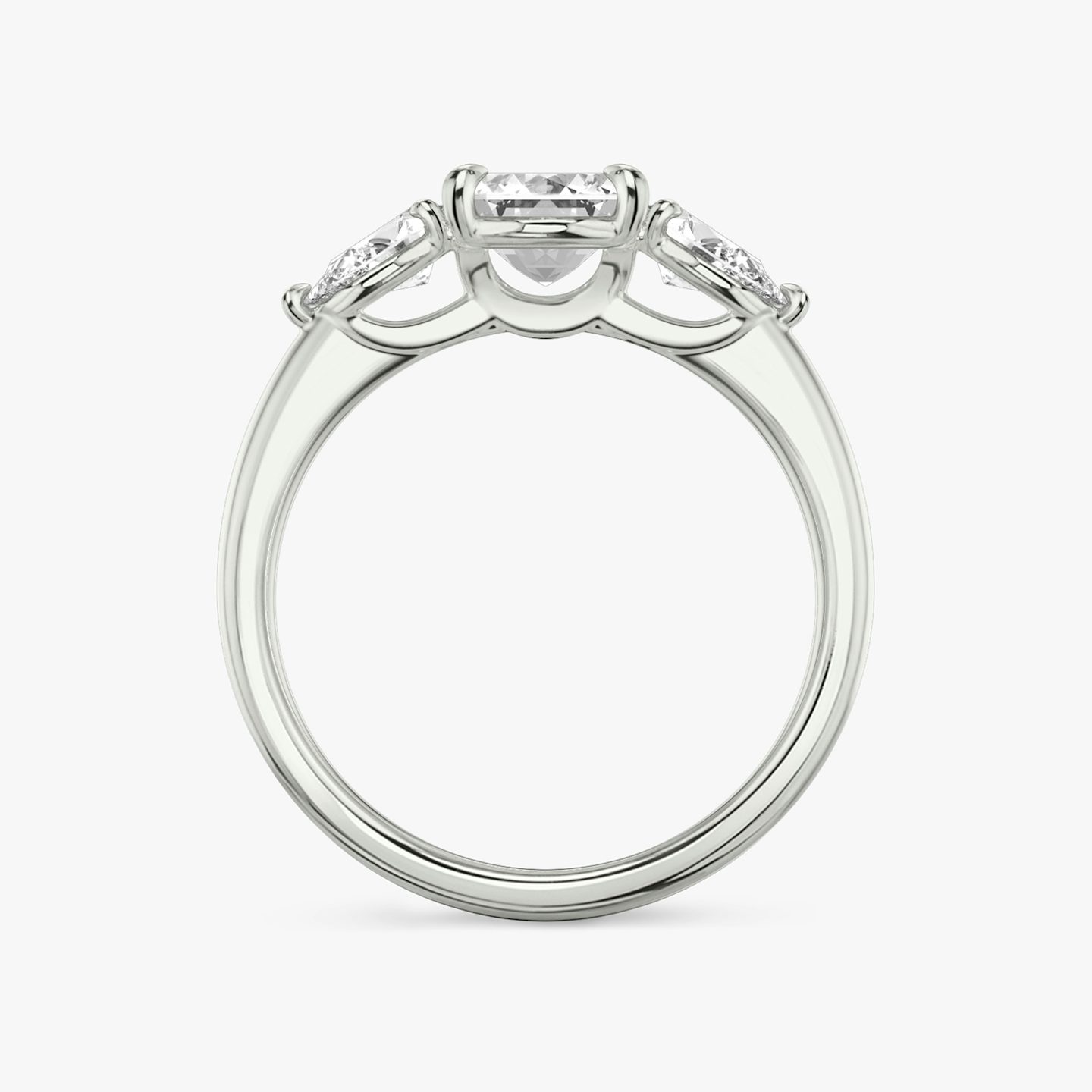 The Three Stone | Emerald | Platinum | bandAccent: Plain | sideStoneCarat: 0.25ct | sideStoneShape: Pear | diamondOrientation: vertical | caratWeight: other