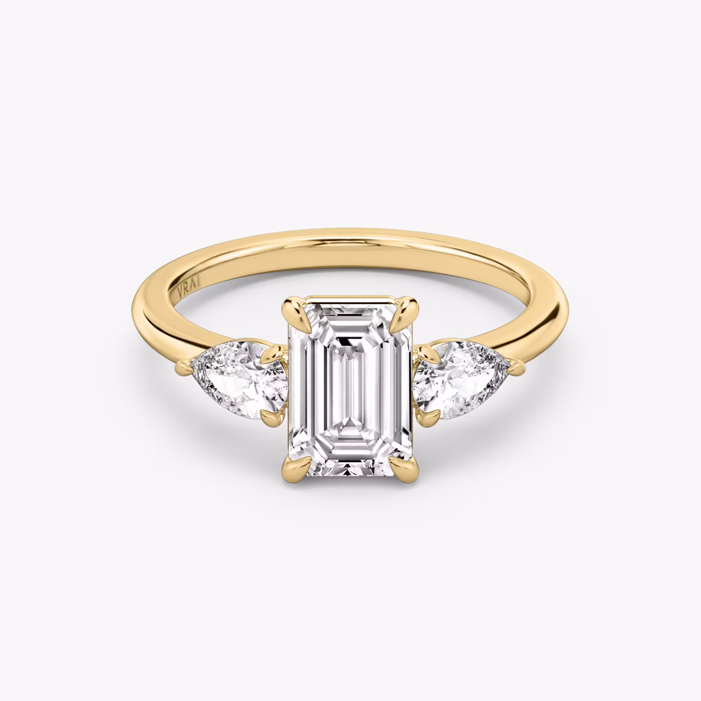 The Three Stone | Emerald | 18k | Yellow Gold | bandAccent: Plain | sideStoneCarat: 0.25ct | sideStoneShape: Pear | diamondOrientation: vertical | caratWeight: other
