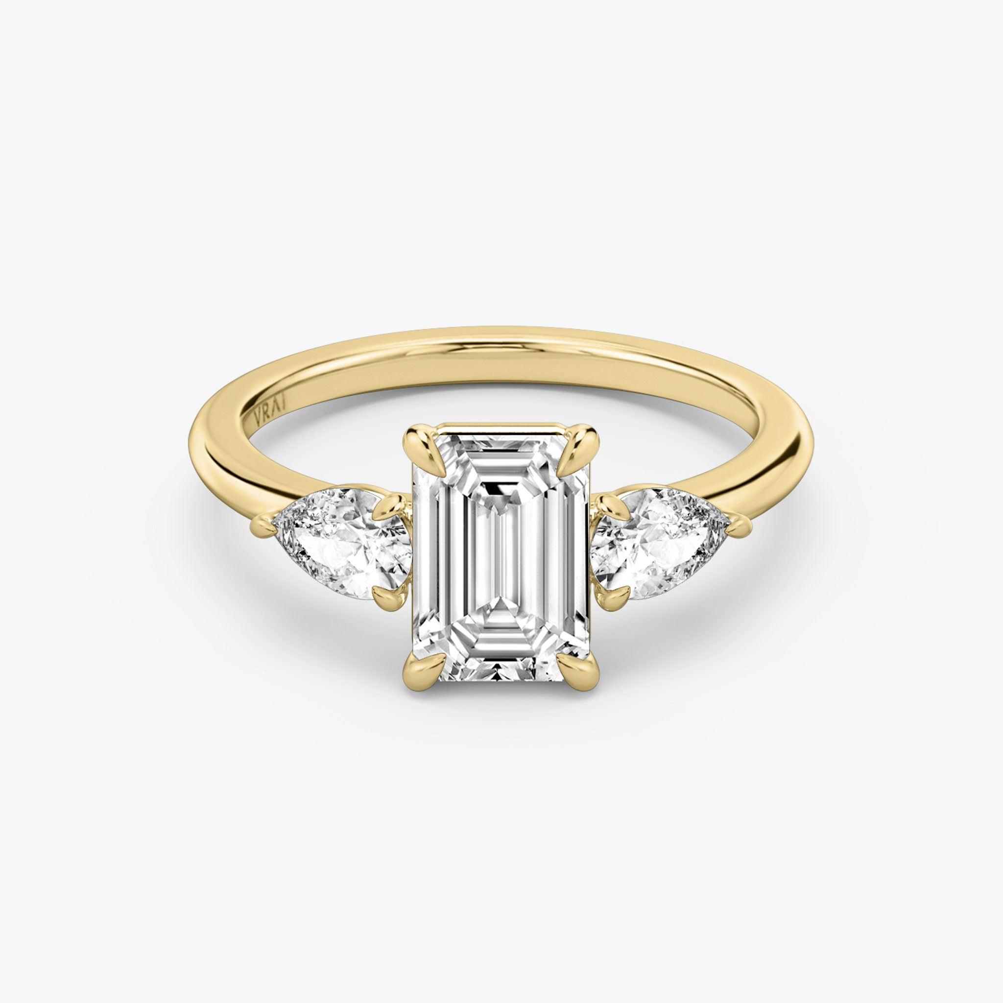 The Three Stone | Emerald | 18k | Yellow Gold | bandAccent: Plain | sideStoneCarat: 0.25ct | sideStoneShape: Pear | diamondOrientation: vertical | caratWeight: other