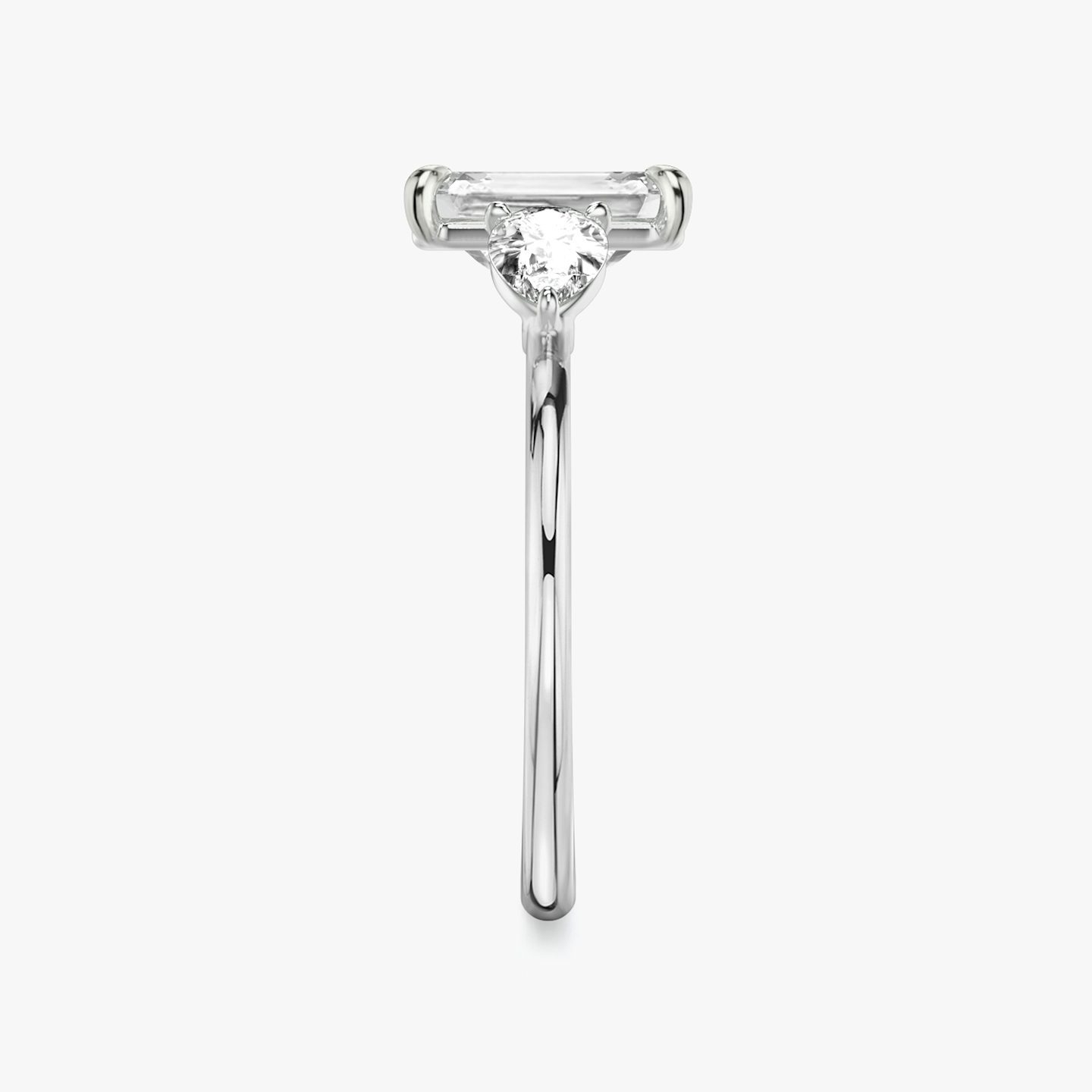 The Three Stone | Emerald | Platinum | bandAccent: Plain | sideStoneCarat: 0.25ct | sideStoneShape: Pear | diamondOrientation: vertical | caratWeight: other