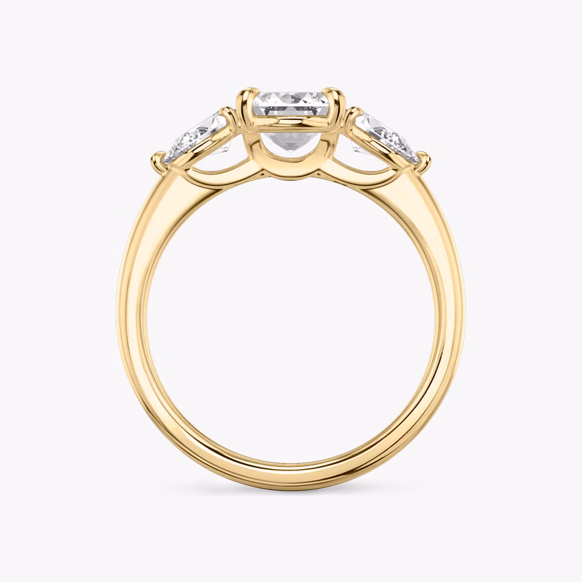 The Three Stone | Emerald | 18k | Yellow Gold | bandAccent: Plain | sideStoneCarat: 0.25ct | sideStoneShape: Pear | diamondOrientation: vertical | caratWeight: other