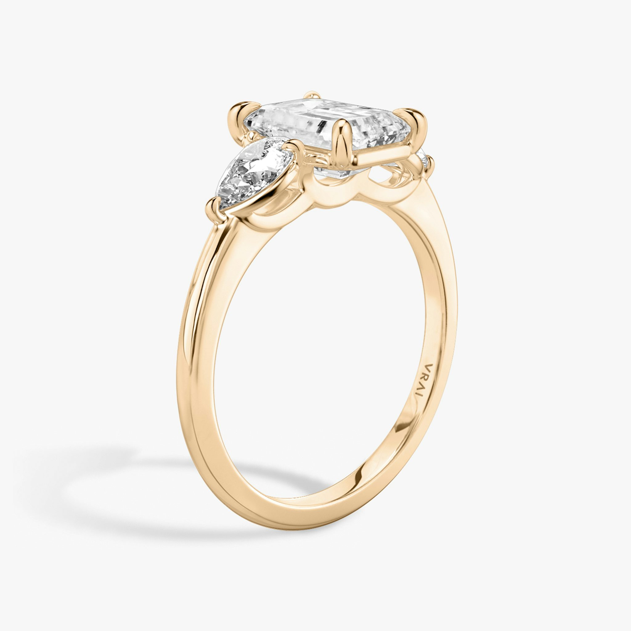 The Three Stone | Emerald | 14k | Rose Gold | bandAccent: Plain | sideStoneCarat: 0.25ct | sideStoneShape: Pear | diamondOrientation: vertical | caratWeight: other