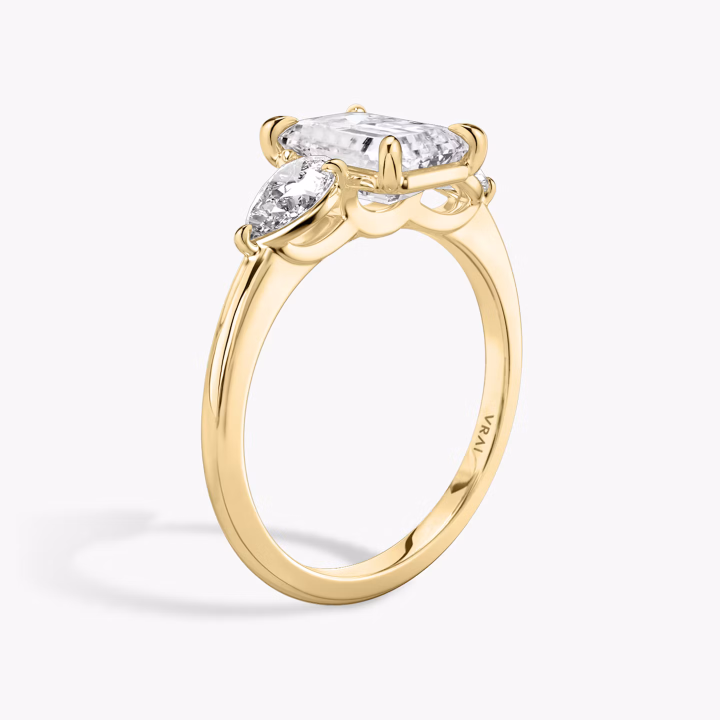 The Three Stone | Emerald | 18k | Yellow Gold | bandAccent: Plain | sideStoneCarat: 0.25ct | sideStoneShape: Pear | diamondOrientation: vertical | caratWeight: other
