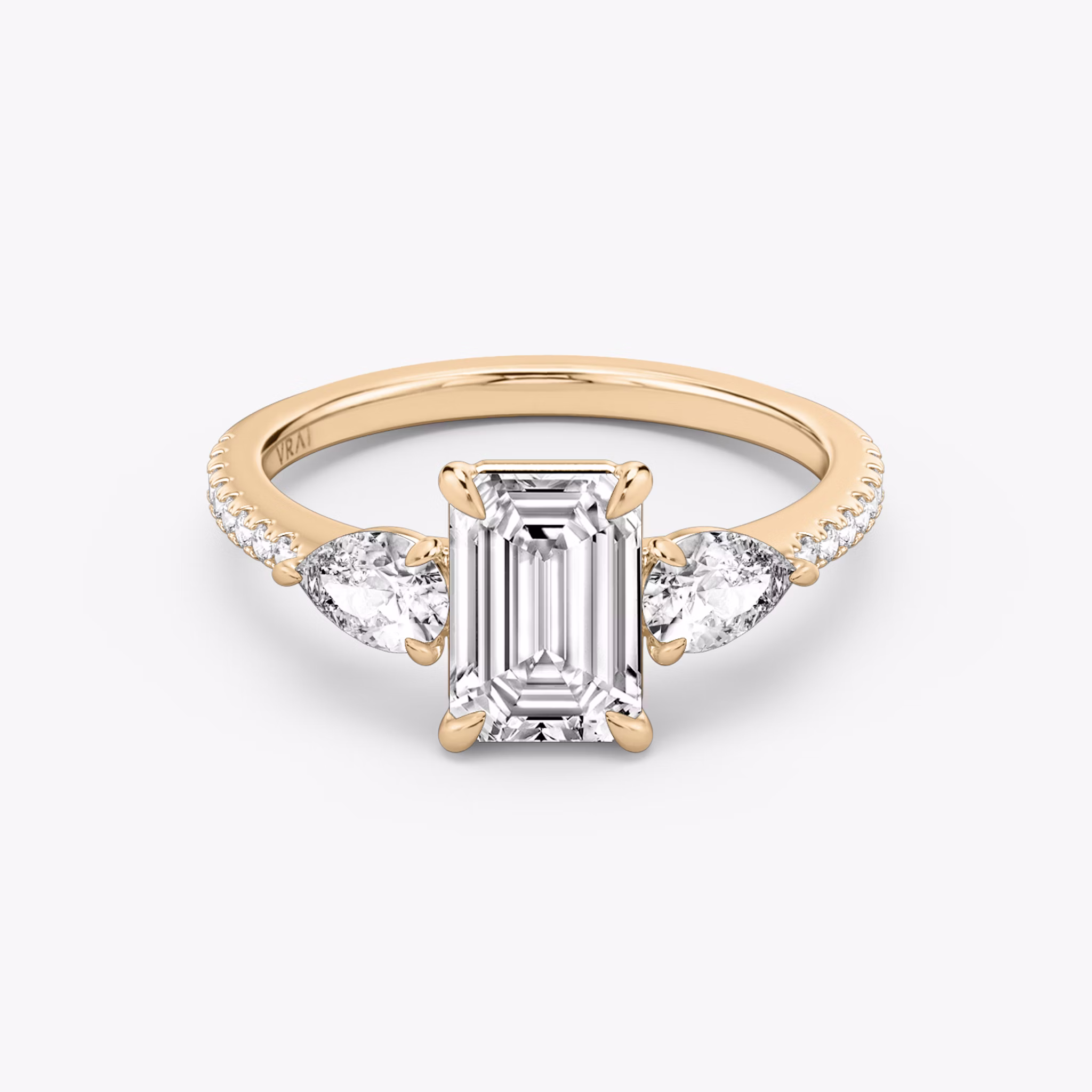 The Three Stone | Emerald | 14k | Rose Gold | bandAccent: Pavé | sideStoneCarat: 0.25ct | sideStoneShape: Pear | diamondOrientation: vertical | caratWeight: other