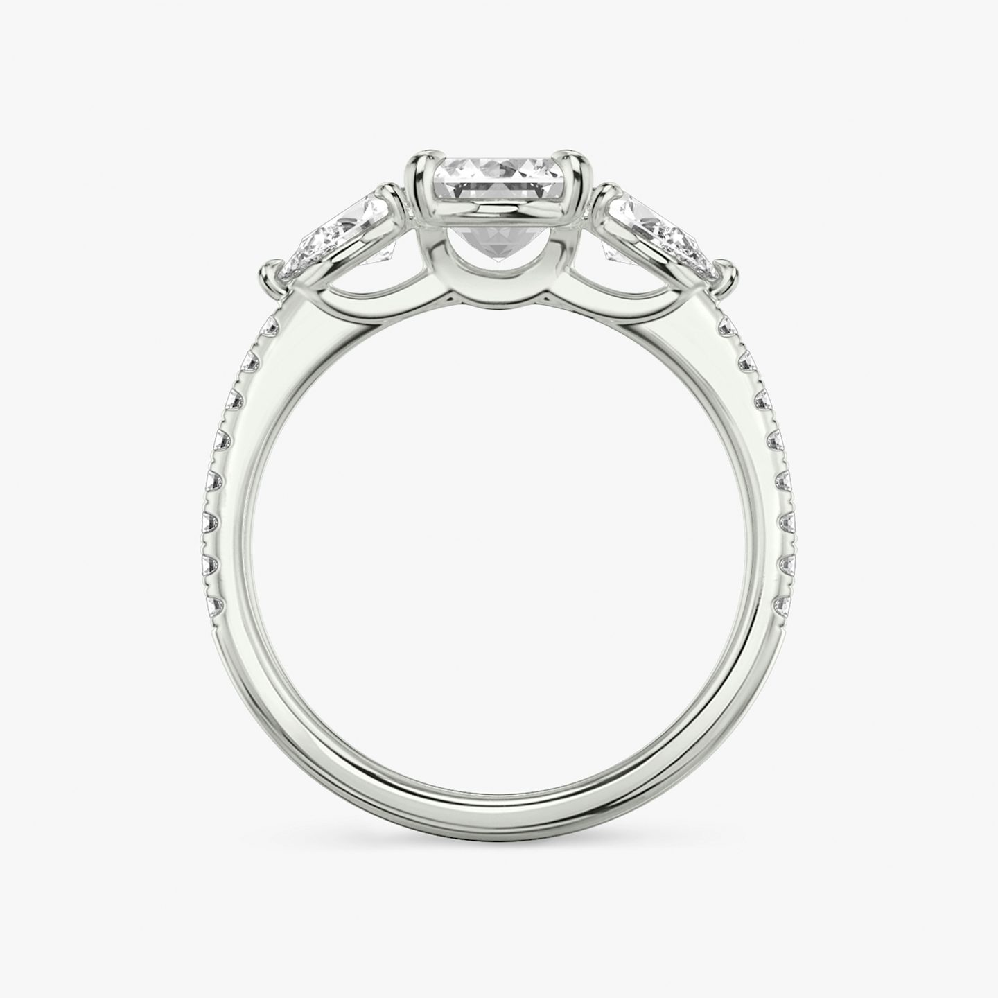 The Three Stone | Emerald | Platinum | bandAccent: Pavé | sideStoneCarat: 0.25ct | sideStoneShape: Pear | diamondOrientation: vertical | caratWeight: other
