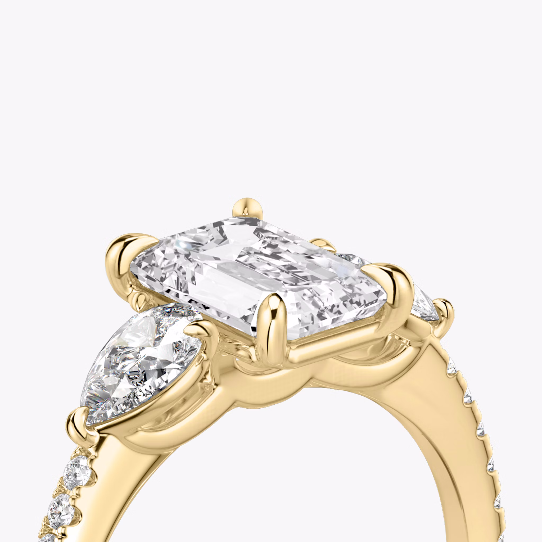 The Three Stone | Emerald | 18k | Yellow Gold | bandAccent: Pavé | sideStoneCarat: 0.25ct | sideStoneShape: Pear | diamondOrientation: vertical | caratWeight: other