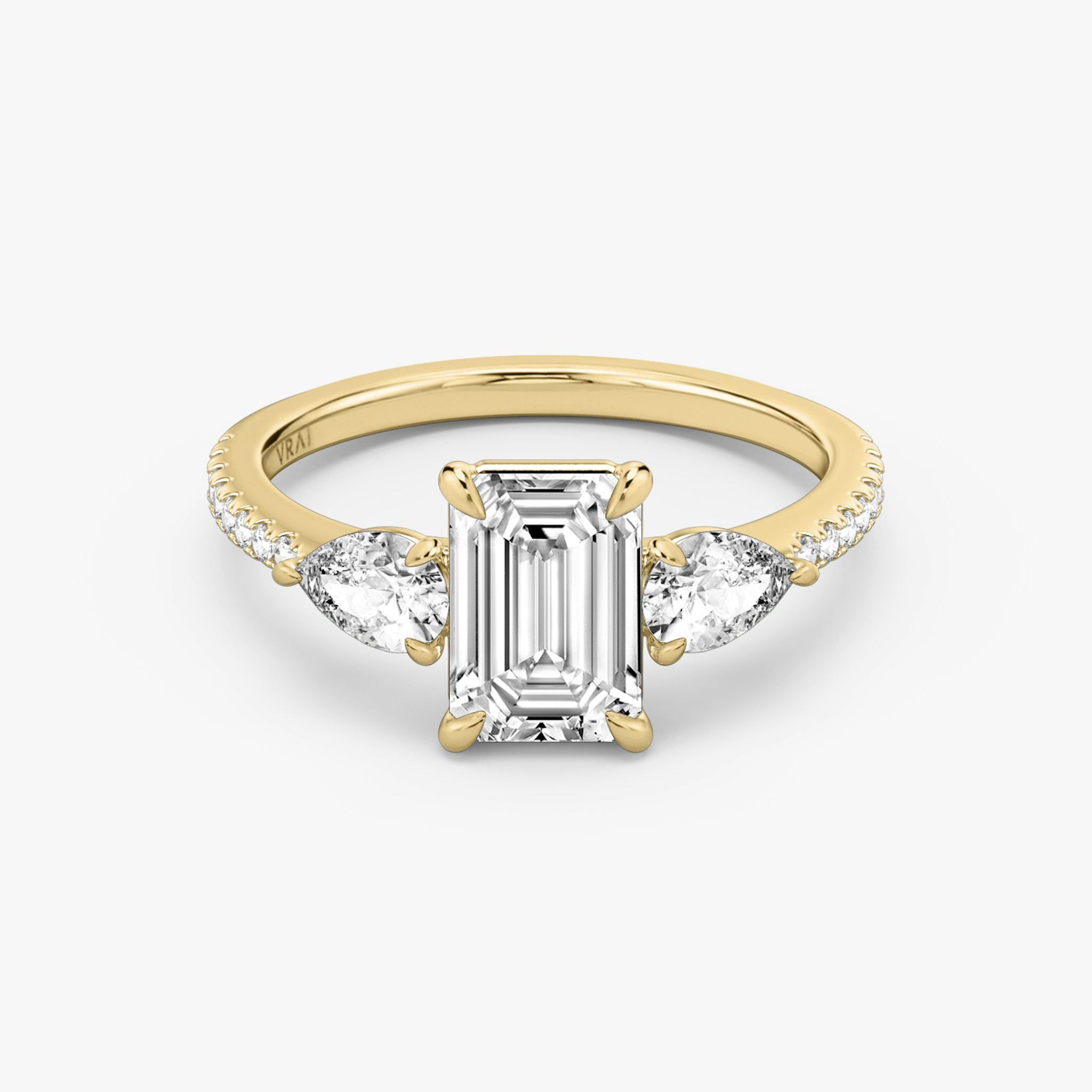 The Three Stone | Emerald | 18k | Yellow Gold | bandAccent: Pavé | sideStoneCarat: 0.25ct | sideStoneShape: Pear | diamondOrientation: vertical | caratWeight: other