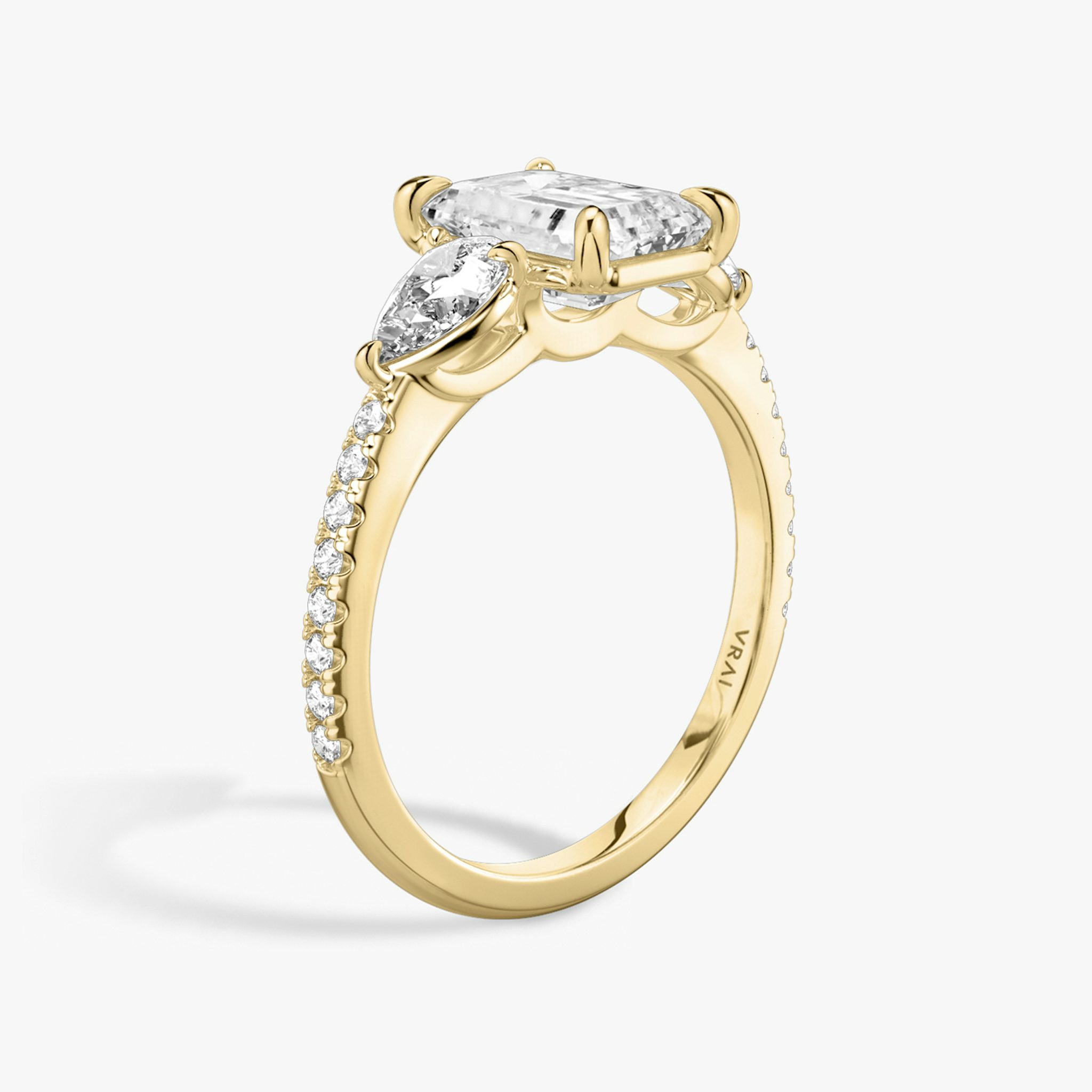 The Three Stone | Emerald | 18k | Yellow Gold | bandAccent: Pavé | sideStoneCarat: 0.25ct | sideStoneShape: Pear | diamondOrientation: vertical | caratWeight: other